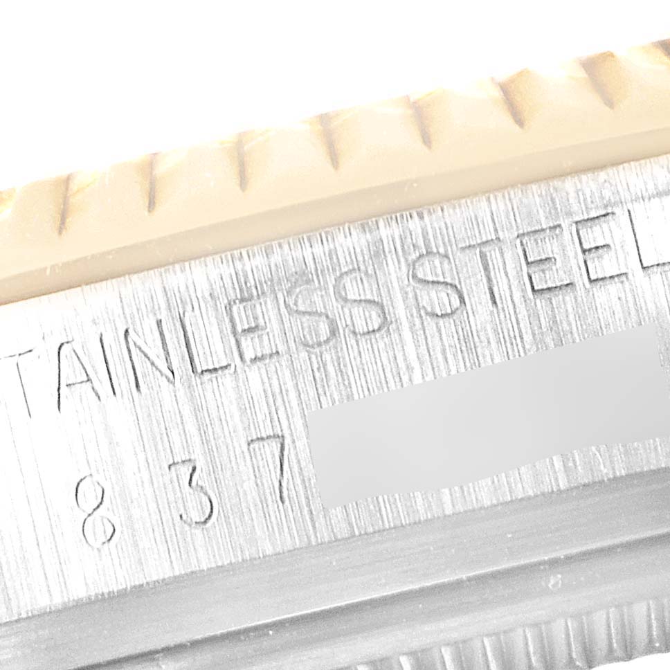 The image shows a close-up of the engraved stainless steel case of a Rolex Datejust 16013 Men's Steel and Gold (two tone) White Dial 16013 Men's Steel and Gold (two tone) White Dial watch.