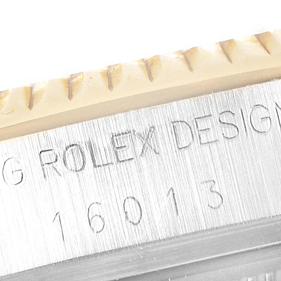This is a close-up image of the case back edge and model engravings on a Rolex Datejust 16013 Men's Steel and Gold (two tone) White Dial 16013 Men's Steel and Gold (two tone) White Dial watch.