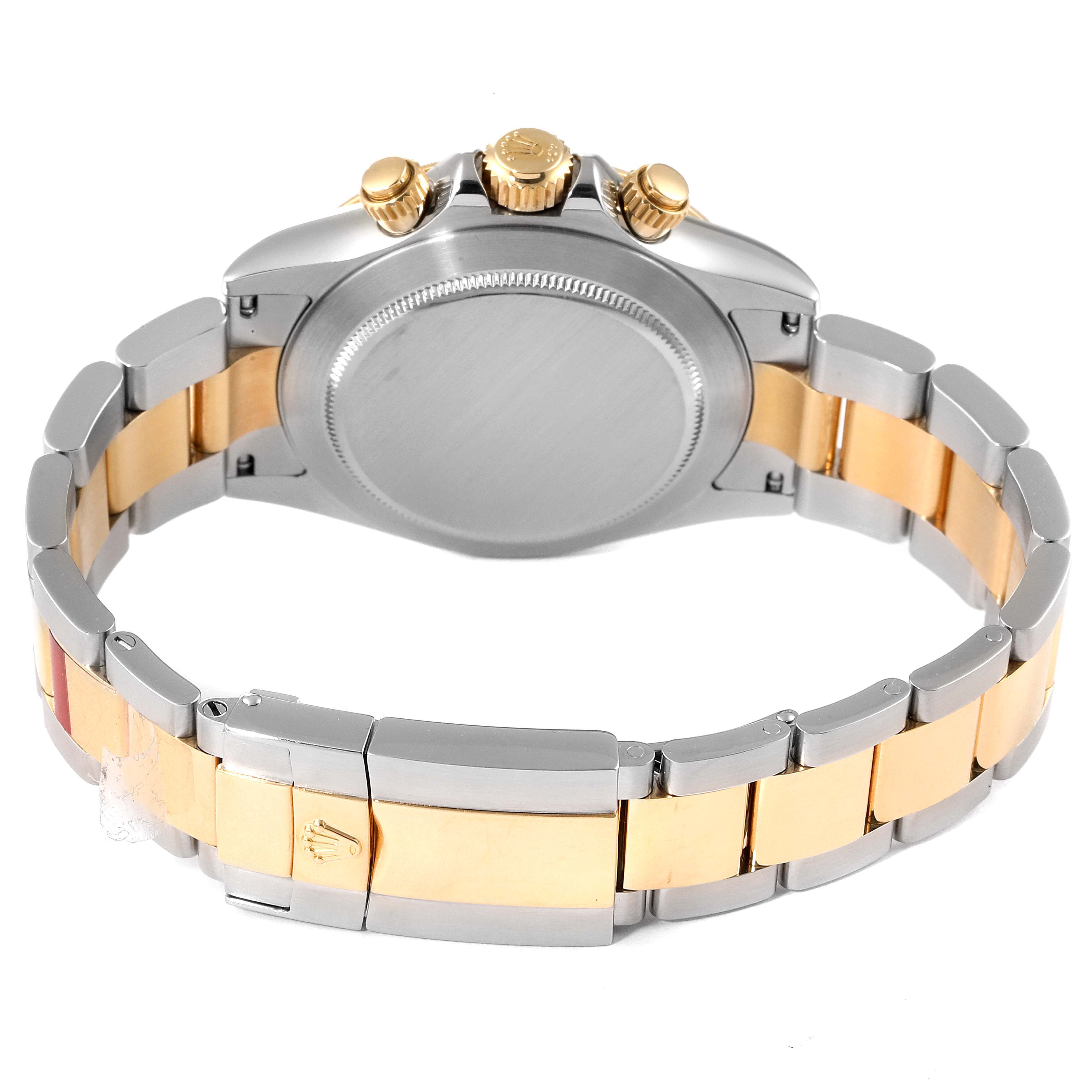 The back view of a Rolex Daytona 116523 Men
s Steel and Gold (two tone) Mother of Pearl Dial 116523 Men
s Steel and Gold (two tone) Mother of Pearl Dial watch displays its gold and steel bracelet, case back, and pushers.