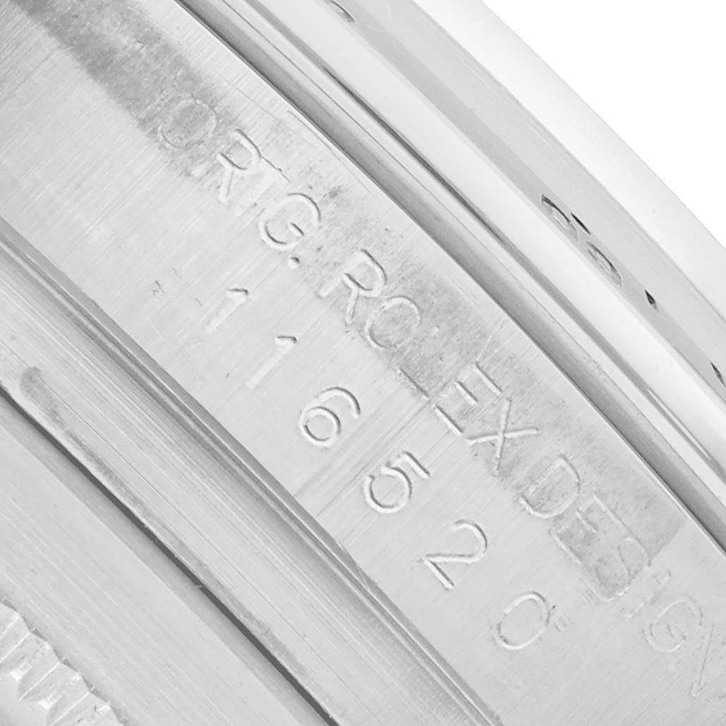 The image shows a close-up of the inner case engraving on a Rolex Daytona 116520 Men
s Stainless Steel White Dial watch.