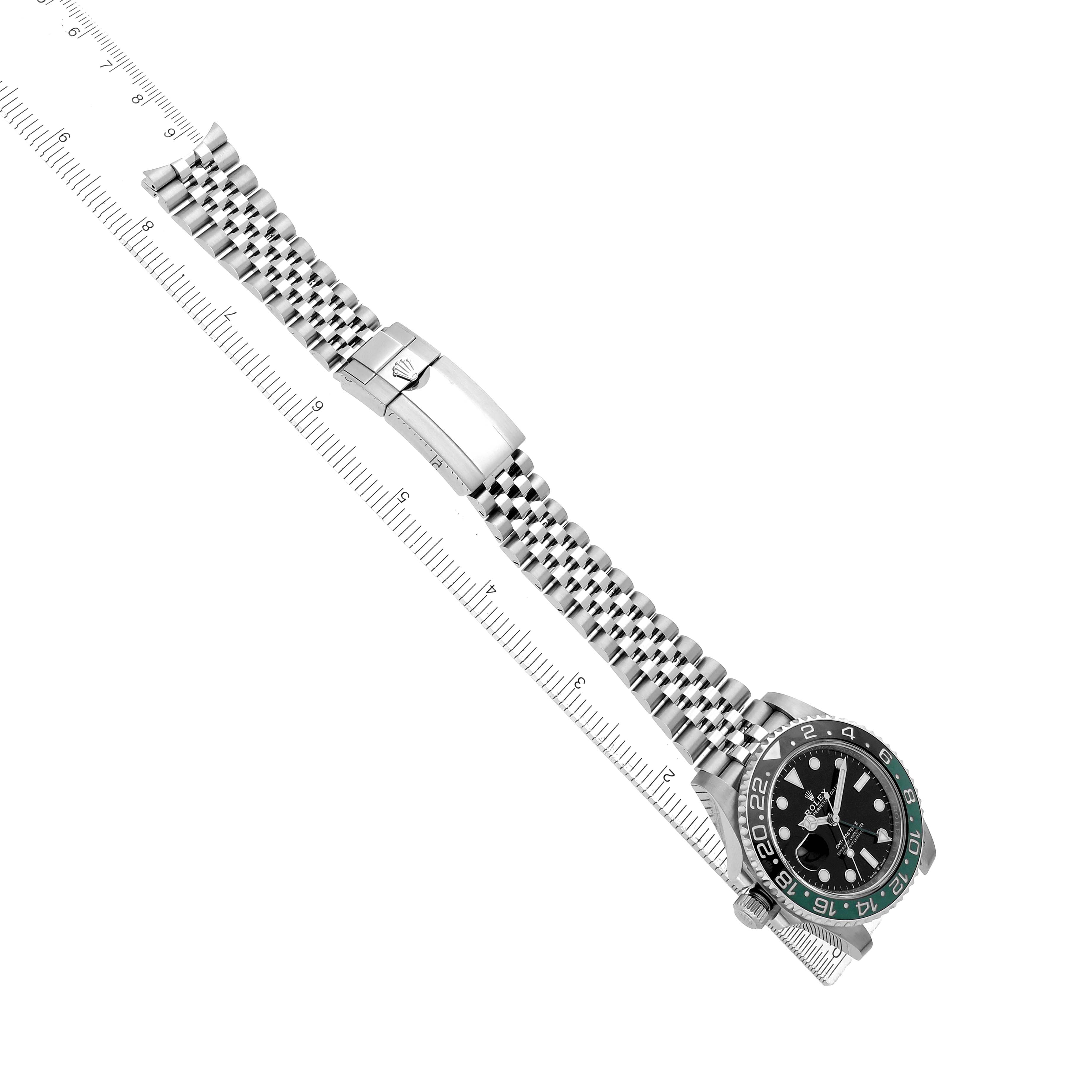 The Rolex GMT-Master 126720 Men
s Stainless Steel Black Dial watch is shown from an overhead angle, displaying the dial, bezel, and metal bracelet with a clasp.