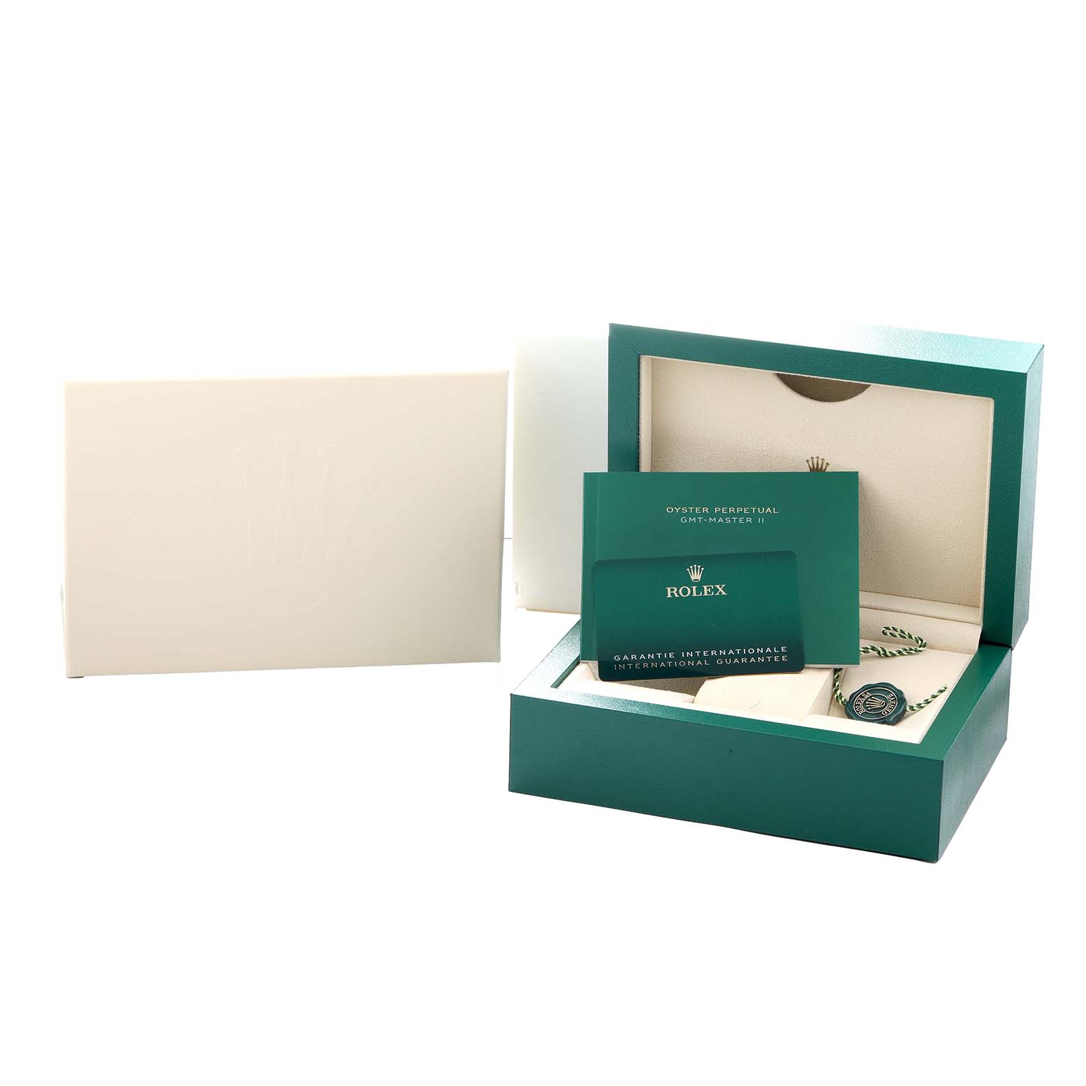 The image shows the packaging and accessories of a Rolex GMT-Master 126720 Men
s Stainless Steel Black Dial, including the box and warranty card, displayed at an angle.