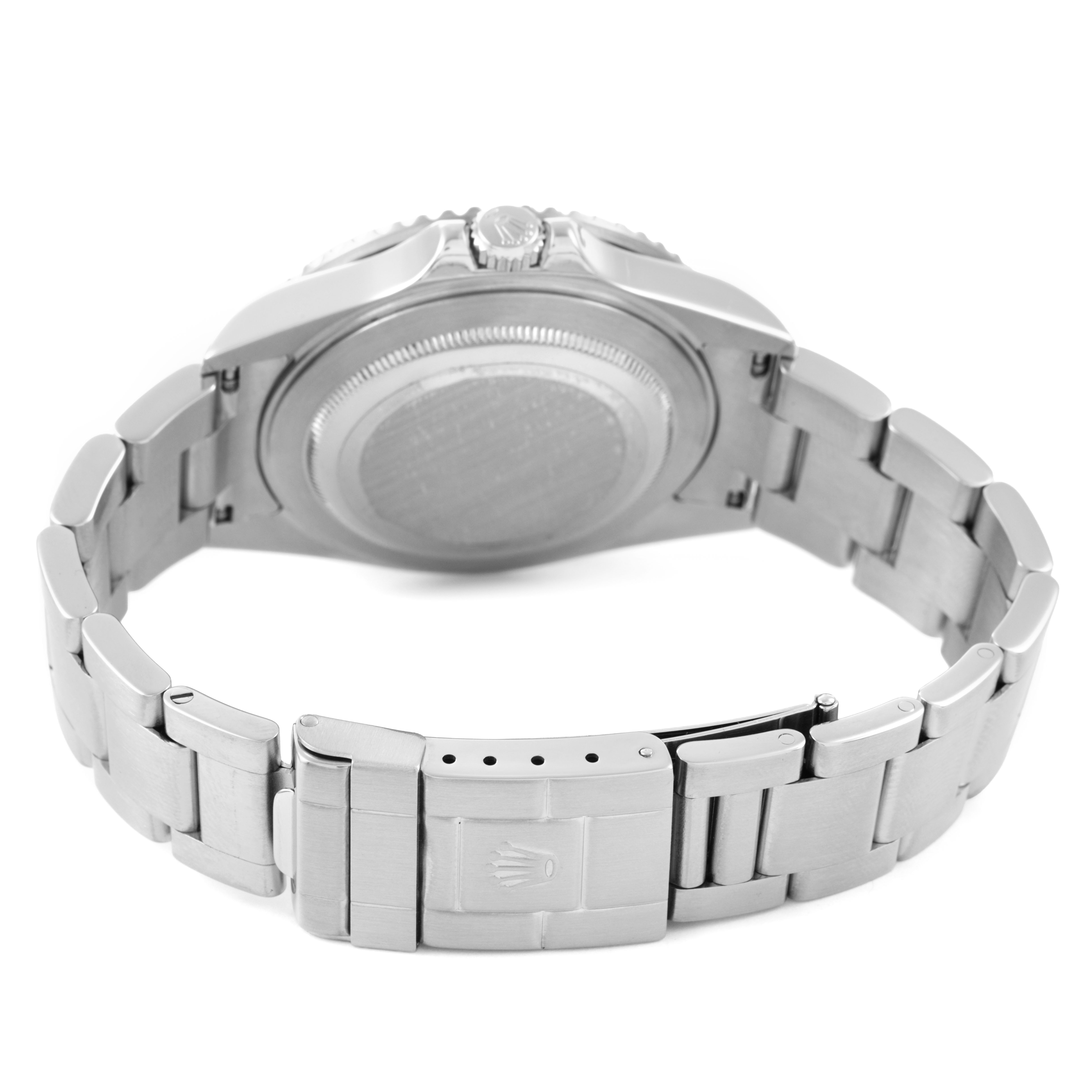 The Rolex GMT-Master 16710 Men's Stainless Steel Black Dial watch is shown from the back, highlighting the closed stainless steel bracelet and clasp.