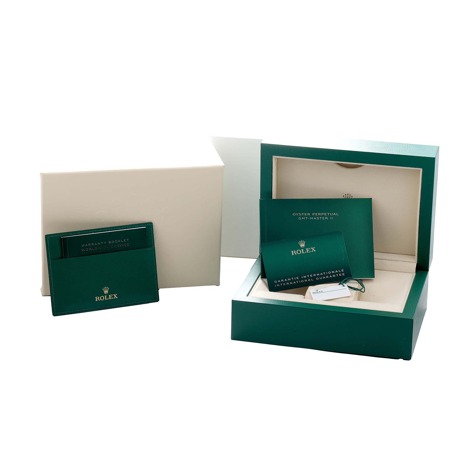 The image shows packaging and accessories for the Rolex GMT-Master 126710 Men
s Stainless Steel Black Dial, including the box, warranty booklet, and international guarantee card.