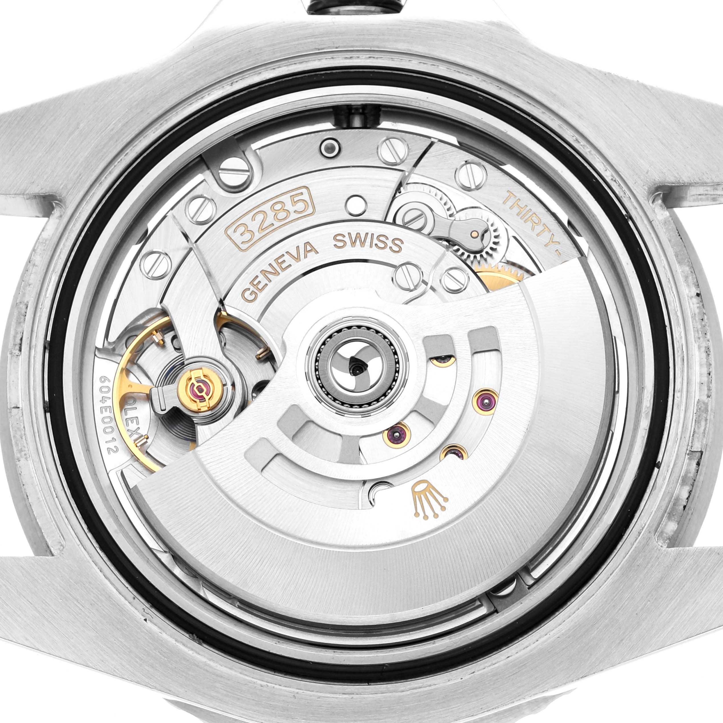 The image shows the back view of a Rolex GMT-Master 126710 Men
s Stainless Steel Black Dial, highlighting its movement and internal mechanisms.