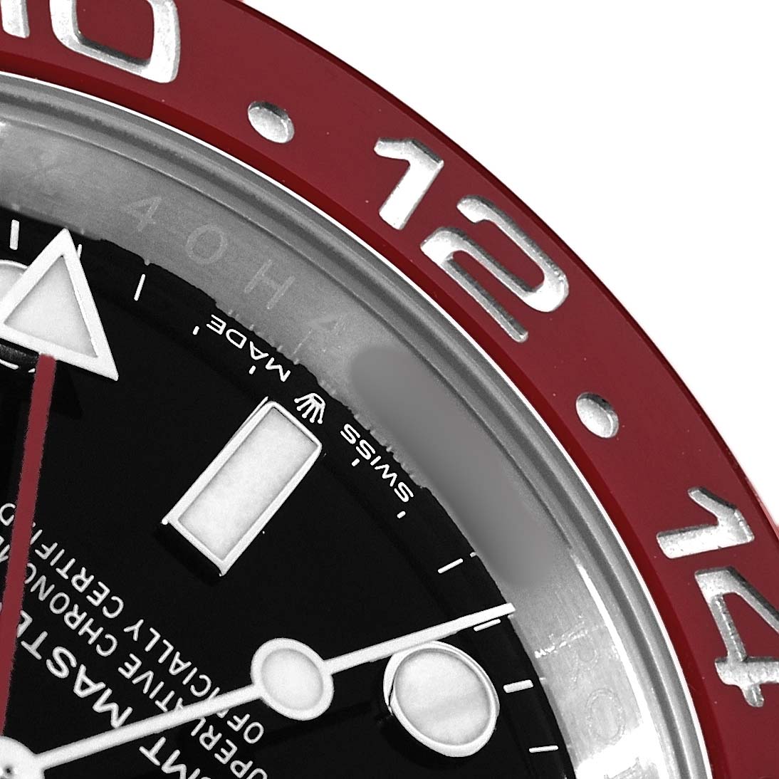 The image shows a close-up of the dial and red bezel of the Rolex GMT-Master 126710 Men
s Stainless Steel Black Dial, focusing on the 12 and 14 markers.