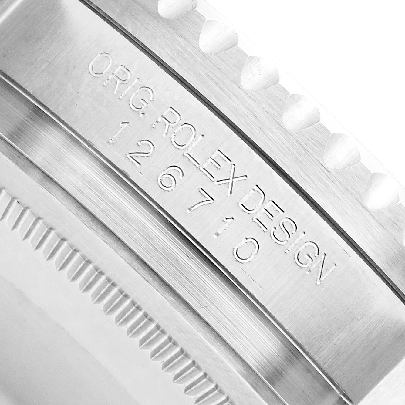 The image shows a close-up angle of the bezel engraving on a Rolex GMT-Master 126710 Men
s Stainless Steel Black Dial watch.