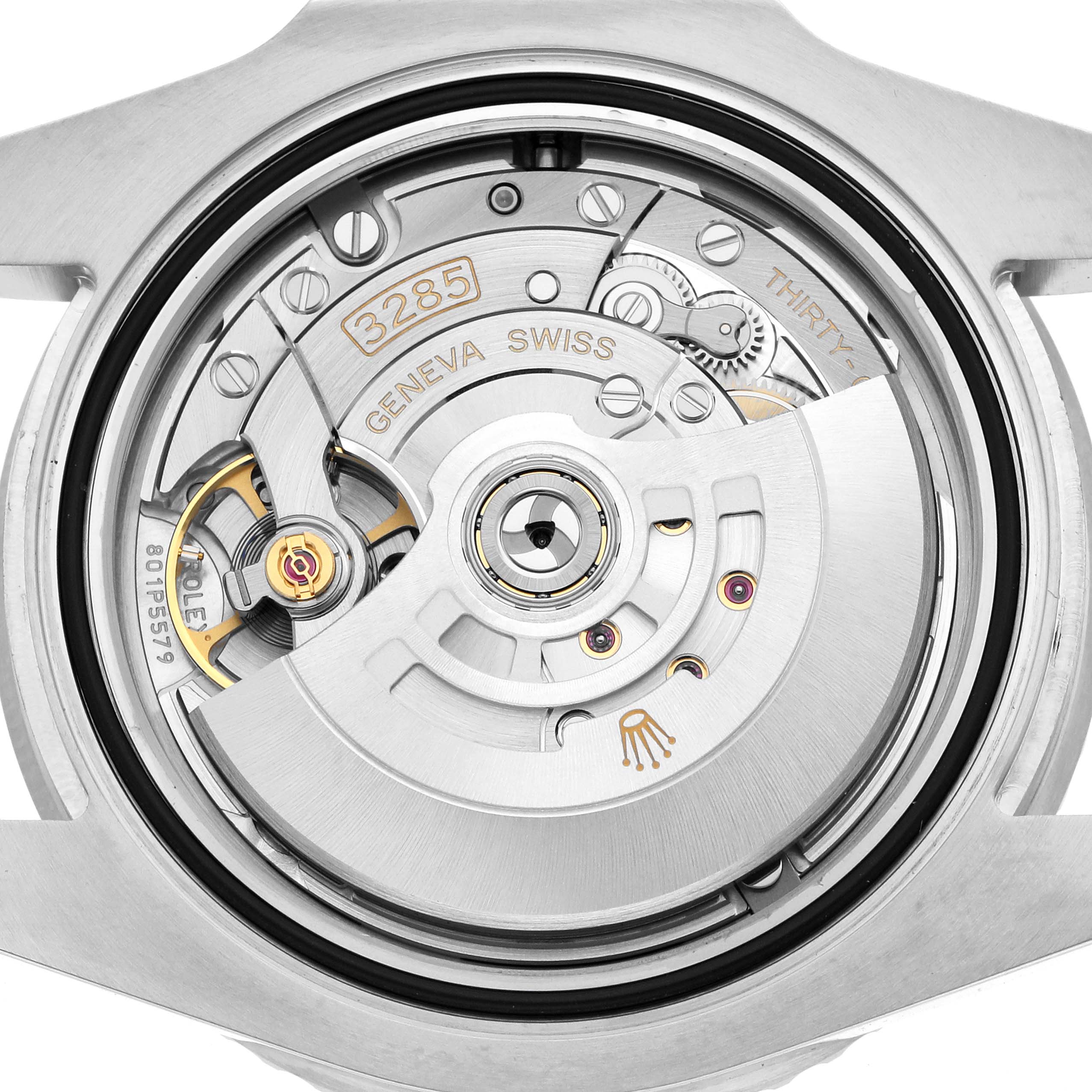 The image shows the back view of a Rolex GMT-Master 126710 Men
s Stainless Steel Black Dial, highlighting the intricate movement and branding details.