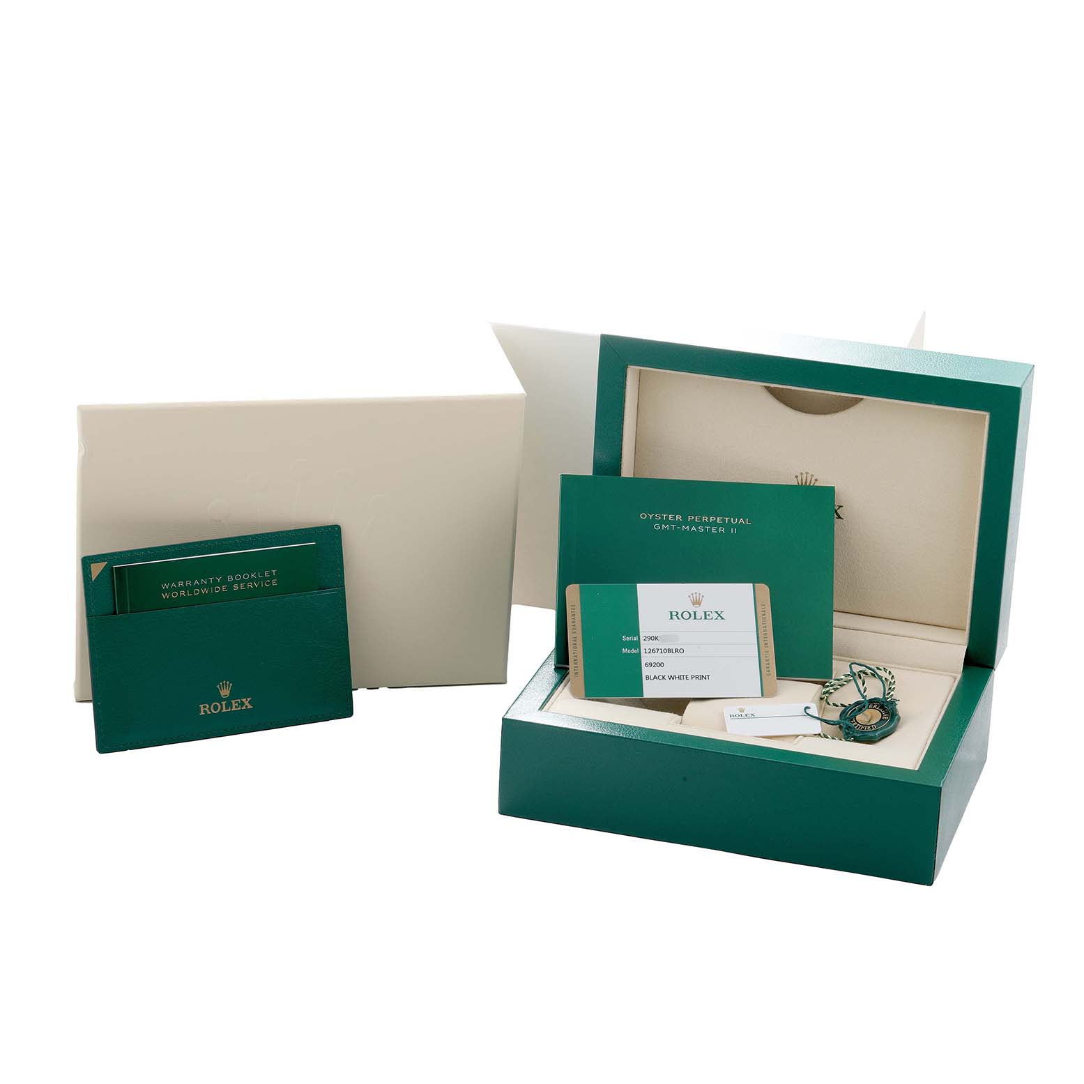 The image shows the opened box and documentation for a Rolex GMT-Master 126710 Men
s Stainless Steel Black Dial watch, with warranty cards and other papers displayed.