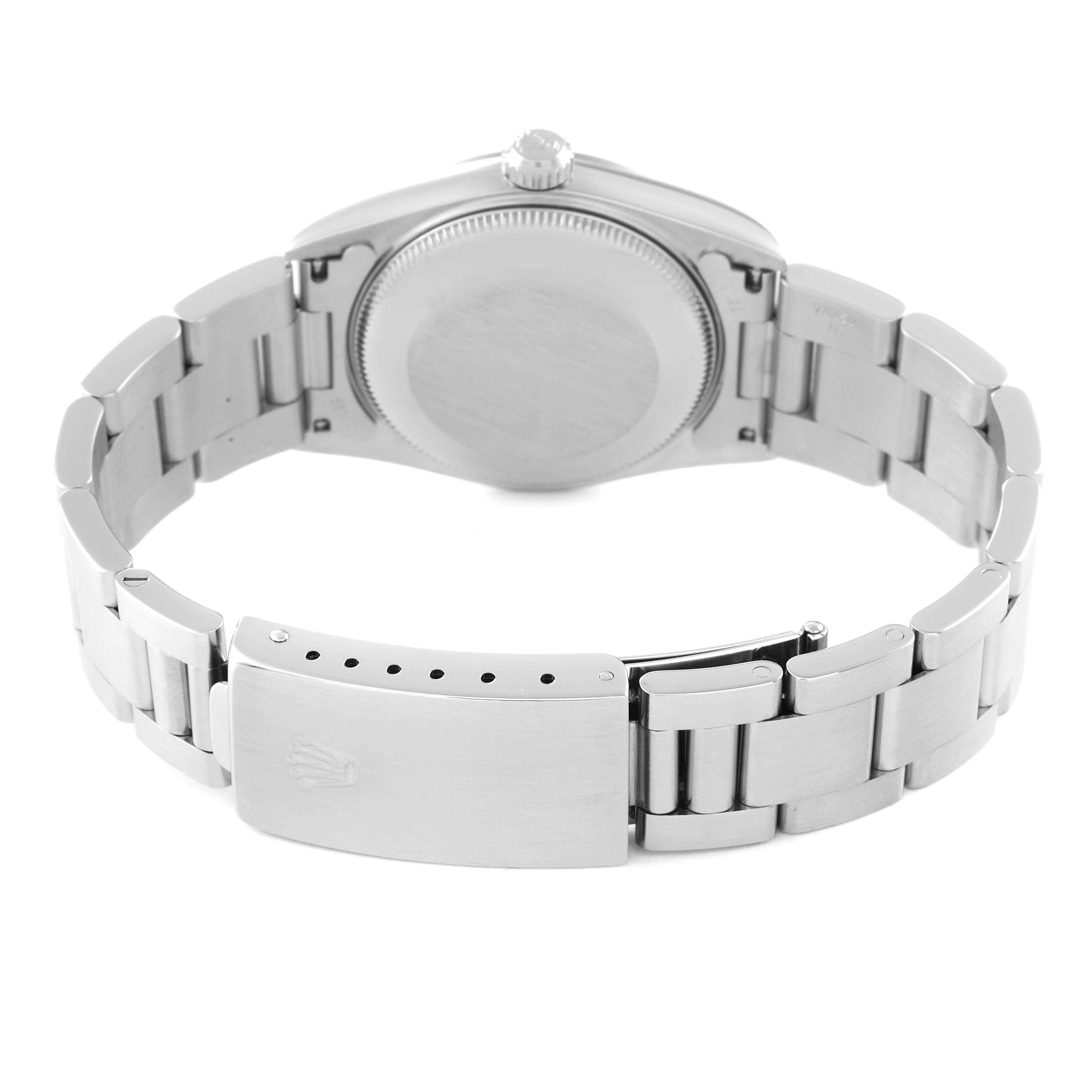 This image shows the back view of a Rolex Mid-Size 77080 Women
s Stainless Steel Black Dial 77080 Women
s Stainless Steel Black Dial watch, specifically highlighting the bracelet, clasp, and case back.