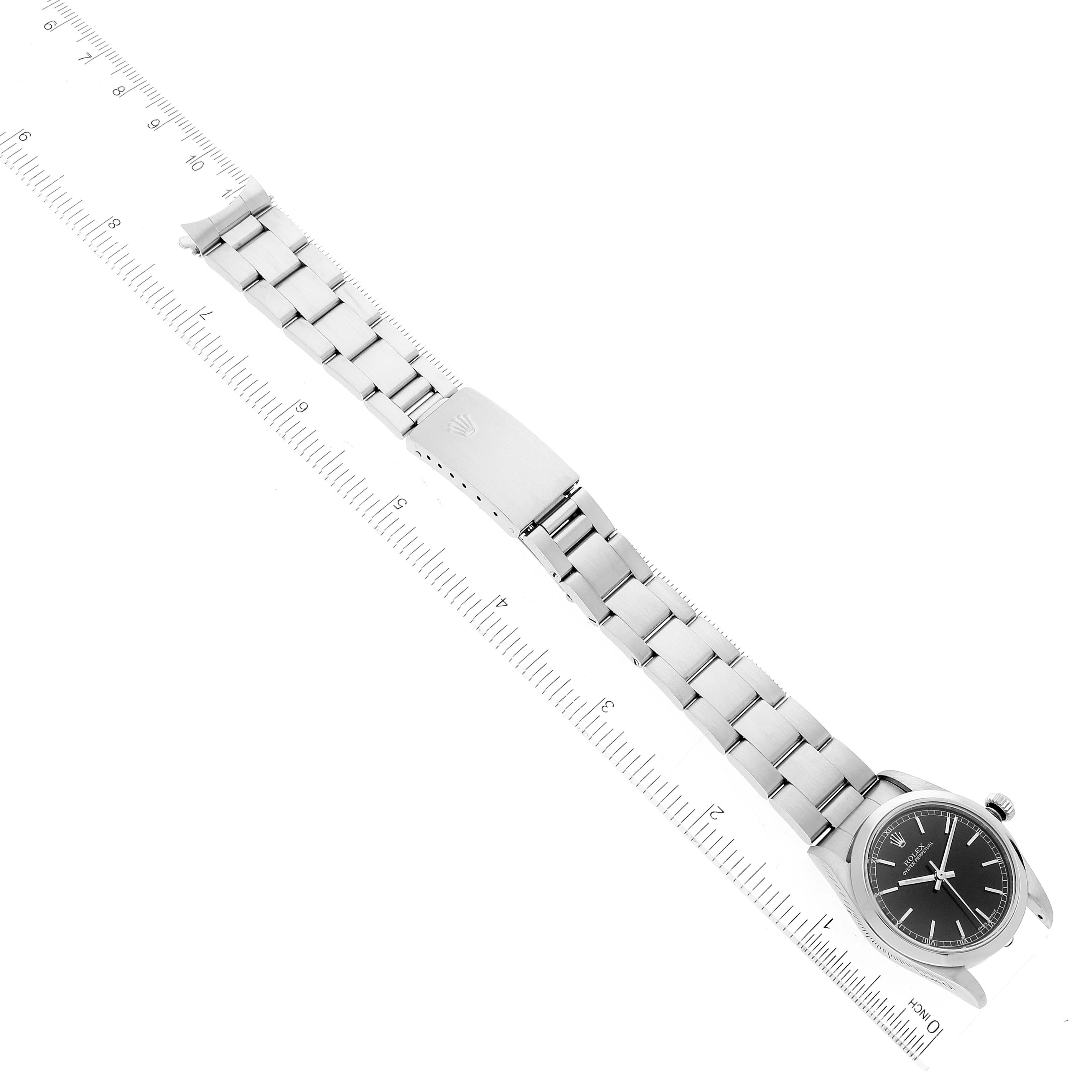 The image shows a top-down view of a Rolex Mid-Size 77080 Women
s Stainless Steel Black Dial 77080 Women
s Stainless Steel Black Dial watch, highlighting the entire bracelet and clasp.