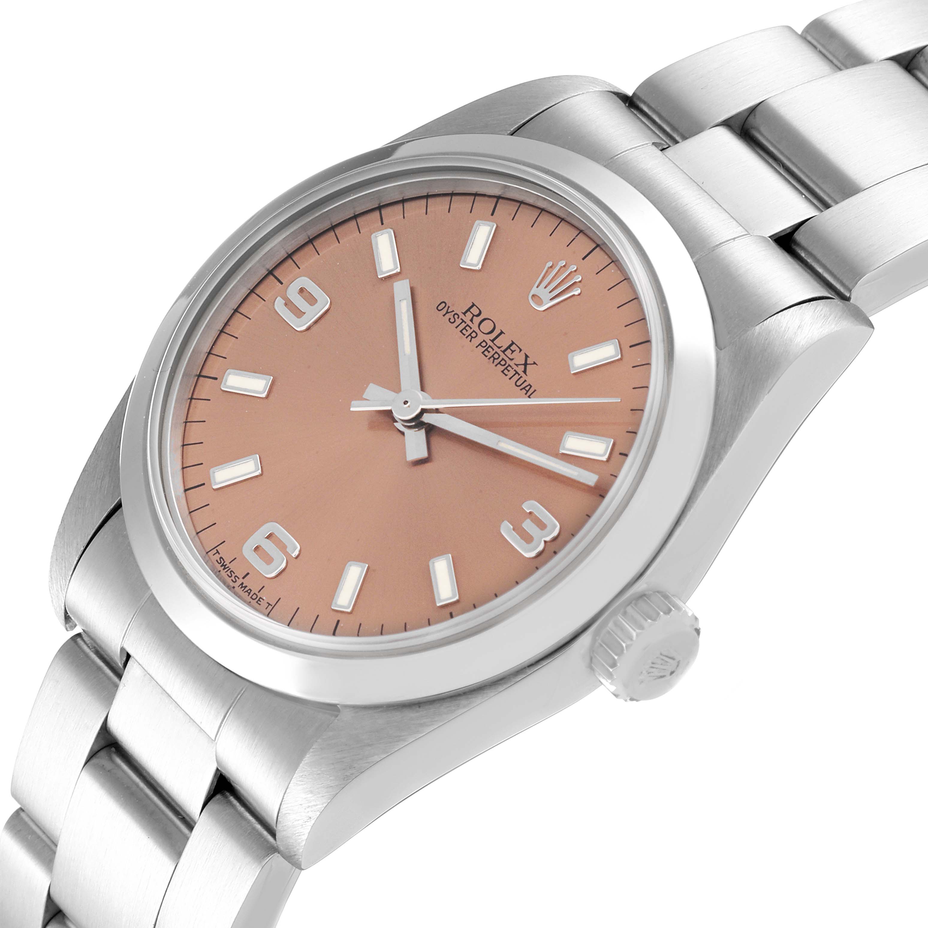 The image shows a Rolex Mid-Size 67480 Women
s Stainless Steel Pink Dial 67480 Women
s Stainless Steel Pink Dial Oyster Perpetual watch at a slight angle, highlighting the face, bezel, crown, and part of the bracelet.