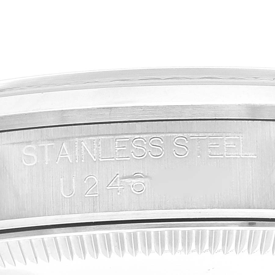The image shows a close-up of the side engraving on a stainless steel case for a Mid-Size Rolex watch.