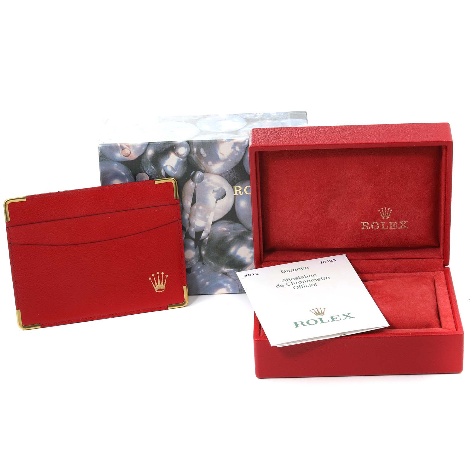 The image shows the packaging and accessories for a Rolex Oyster Perpetual 76183 Women's Steel and Gold (two tone) Grey Dial 76183 Women's Steel and Gold (two tone) Grey Dial watch, including the box, warranty card holder, and booklet.