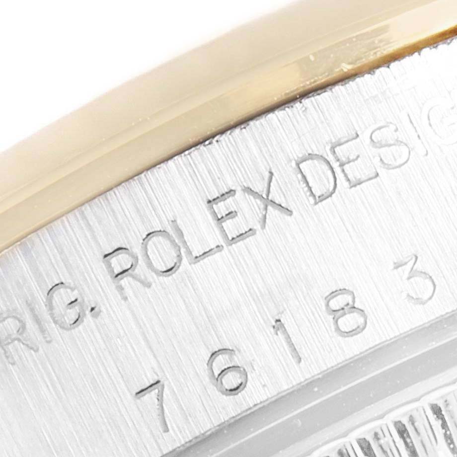 This is a close-up of the side of a Rolex Oyster Perpetual 76183 Women's Steel and Gold (two tone) Grey Dial 76183 Women's Steel and Gold (two tone) Grey Dial watch, showing the engraved model and design details.