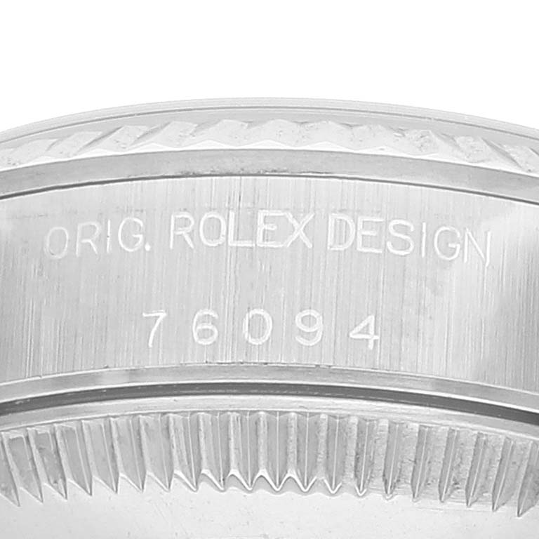 This image shows a close-up view of the case engravings on an Oyster Perpetual Rolex watch, highlighting the model number "76094."
