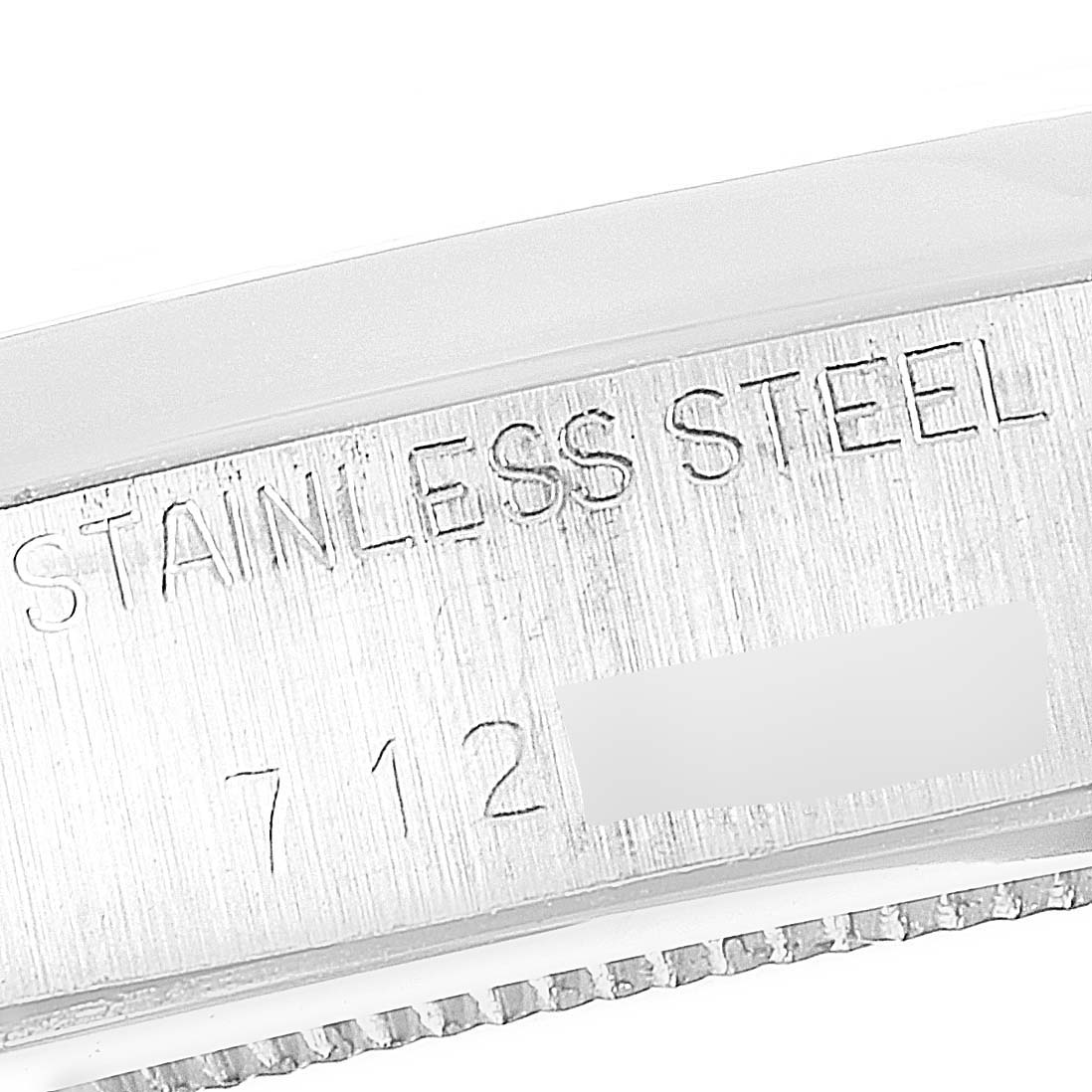 The image shows the side engraving on the stainless steel case of a Rolex Vintage Collection 6694 Men's Stainless Steel Silver Dial 6694 Men's Stainless Steel Silver Dial model watch.