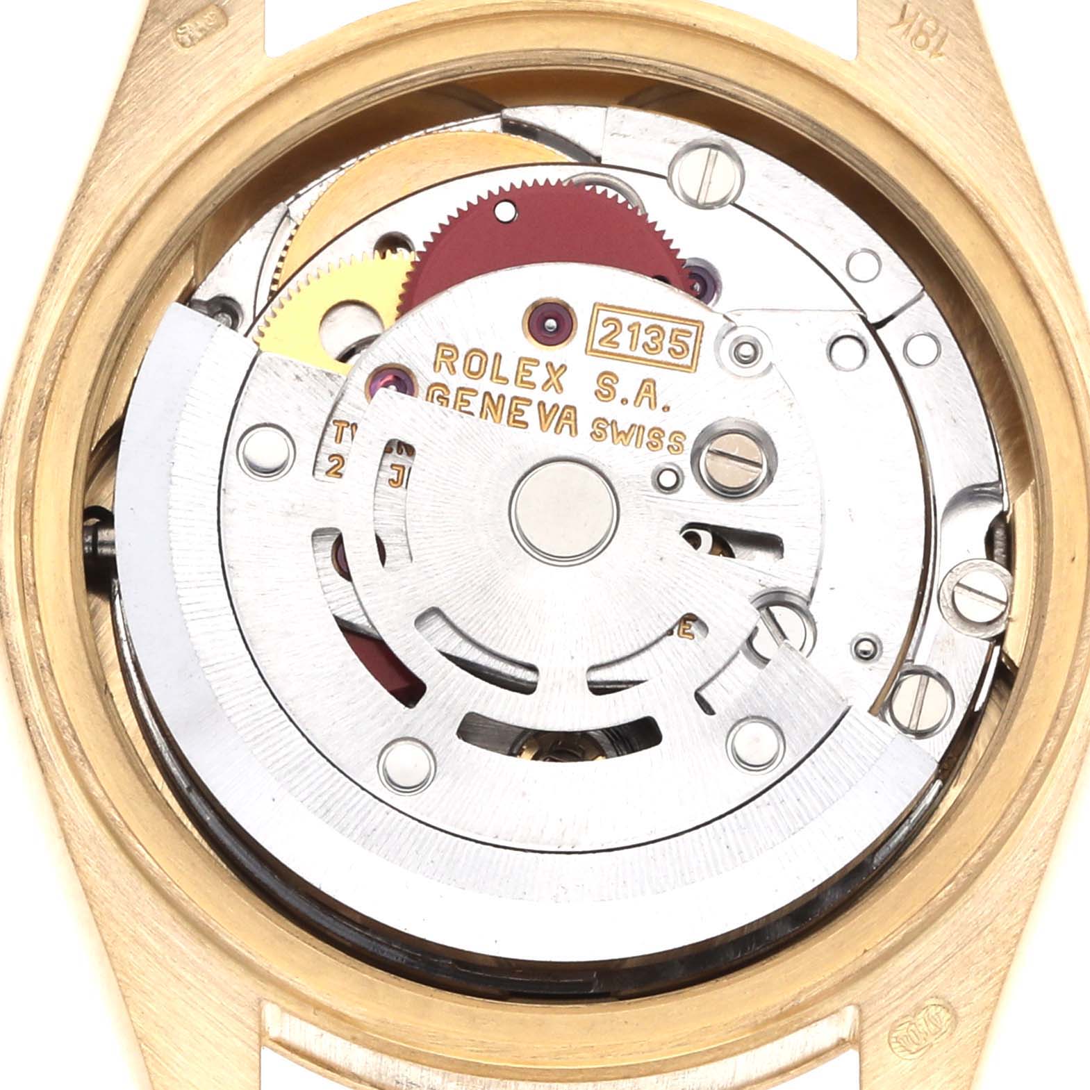 The image shows the inner mechanism of the Rolex President 69178 Women
s Yellow Gold Champagne Dial model watch from a top view, highlighting its intricate movement parts.