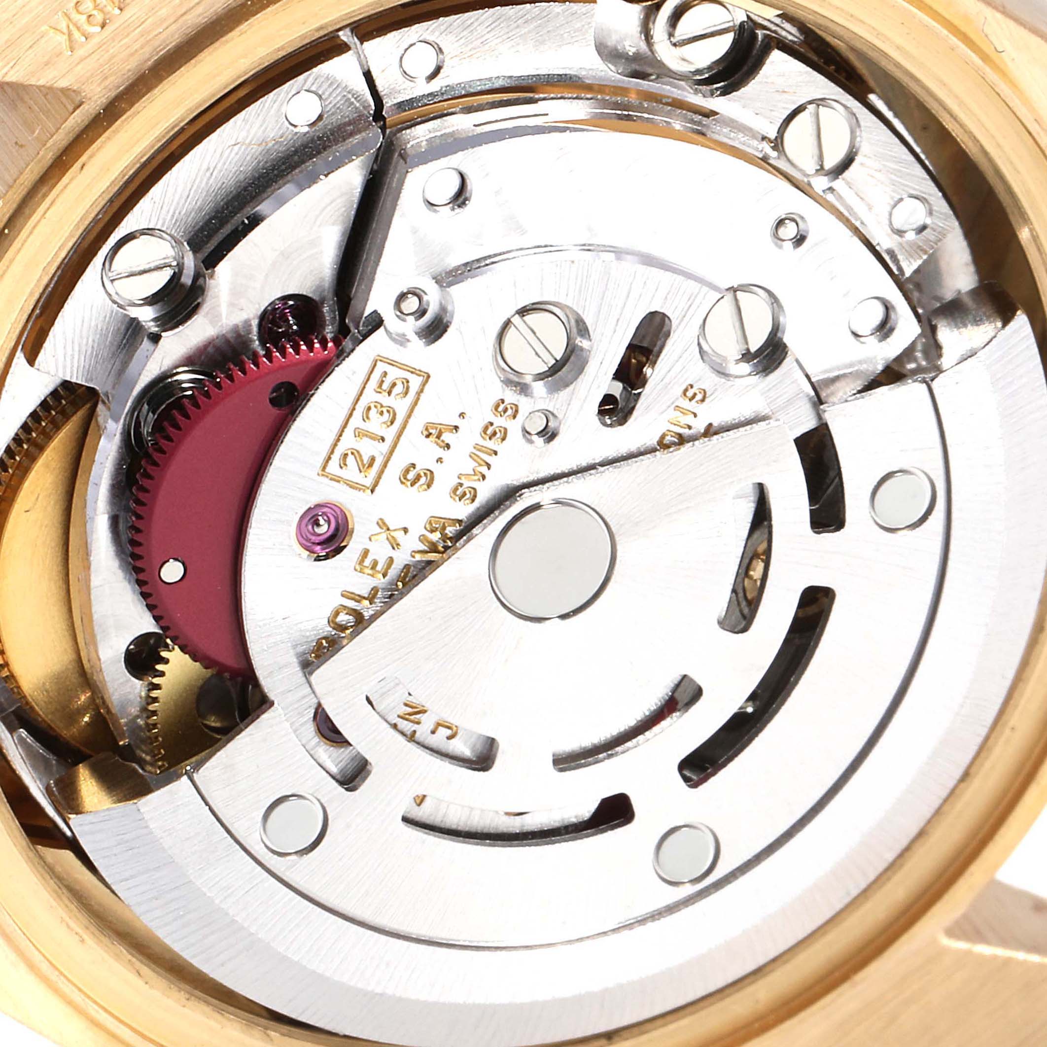 The image shows the internal mechanism of a Rolex President 69288 Men
s Yellow Gold Black Dial 69288 Men
s Yellow Gold Black Dial model watch, viewed from the back, highlighting its intricate components.
