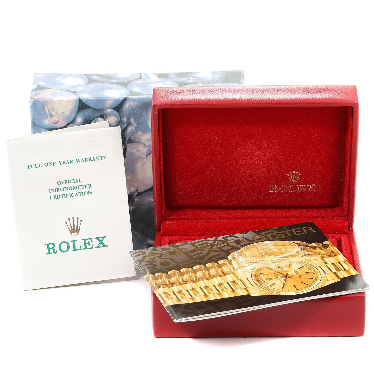 The image shows an empty Rolex President 69288 Men
s Yellow Gold Black Dial 69288 Men
s Yellow Gold Black Dial watch box, a booklet, and warranty card.