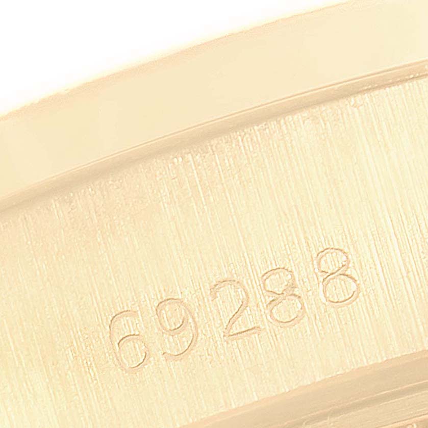 This image shows a close-up of the engraved model number "69288" on the Rolex President 69288 Men
s Yellow Gold Black Dial 69288 Men
s Yellow Gold Black Dial watch case.