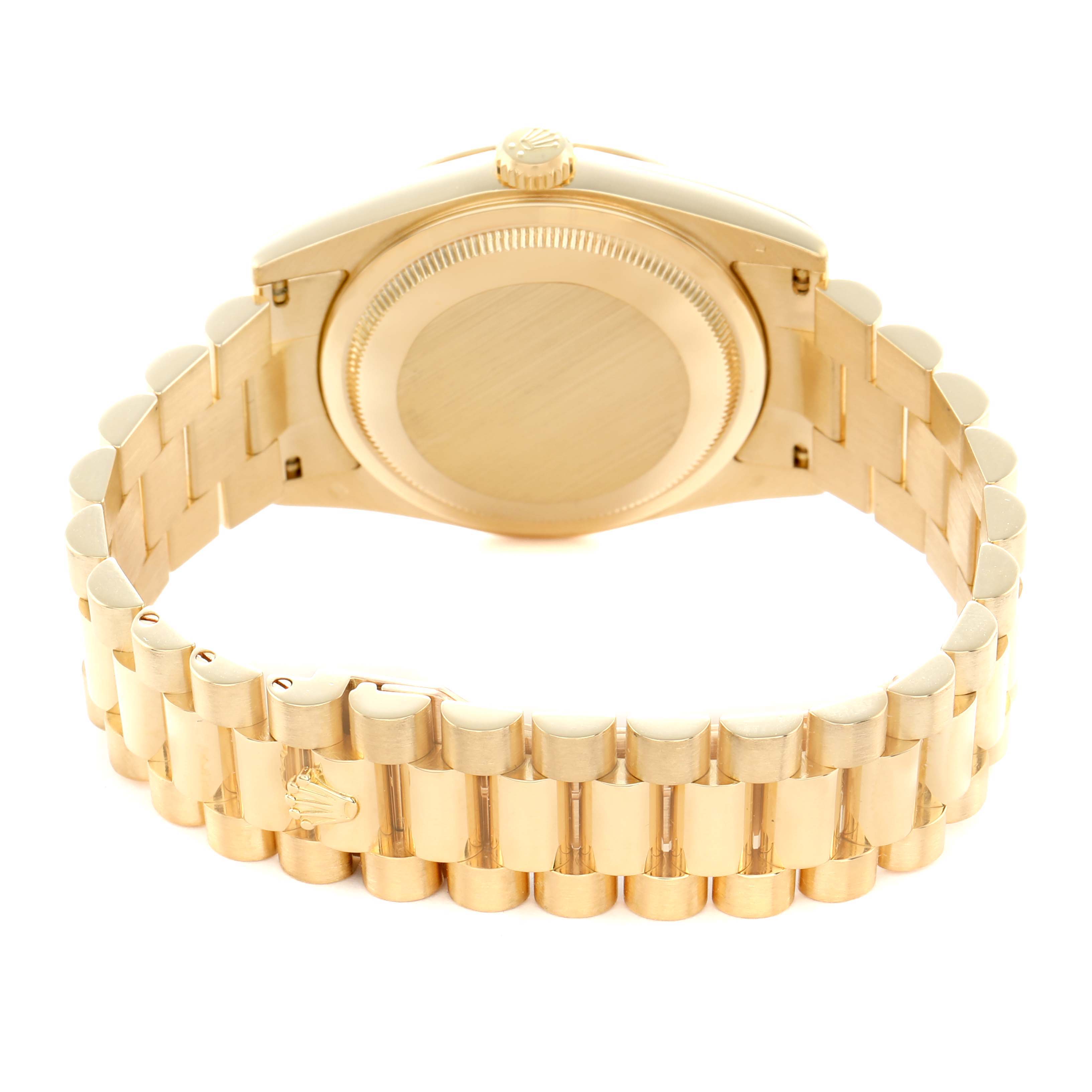 The image shows the back view of a Rolex President 118238 Men
s Yellow Gold Champagne Dial model watch, highlighting the case back and bracelet.