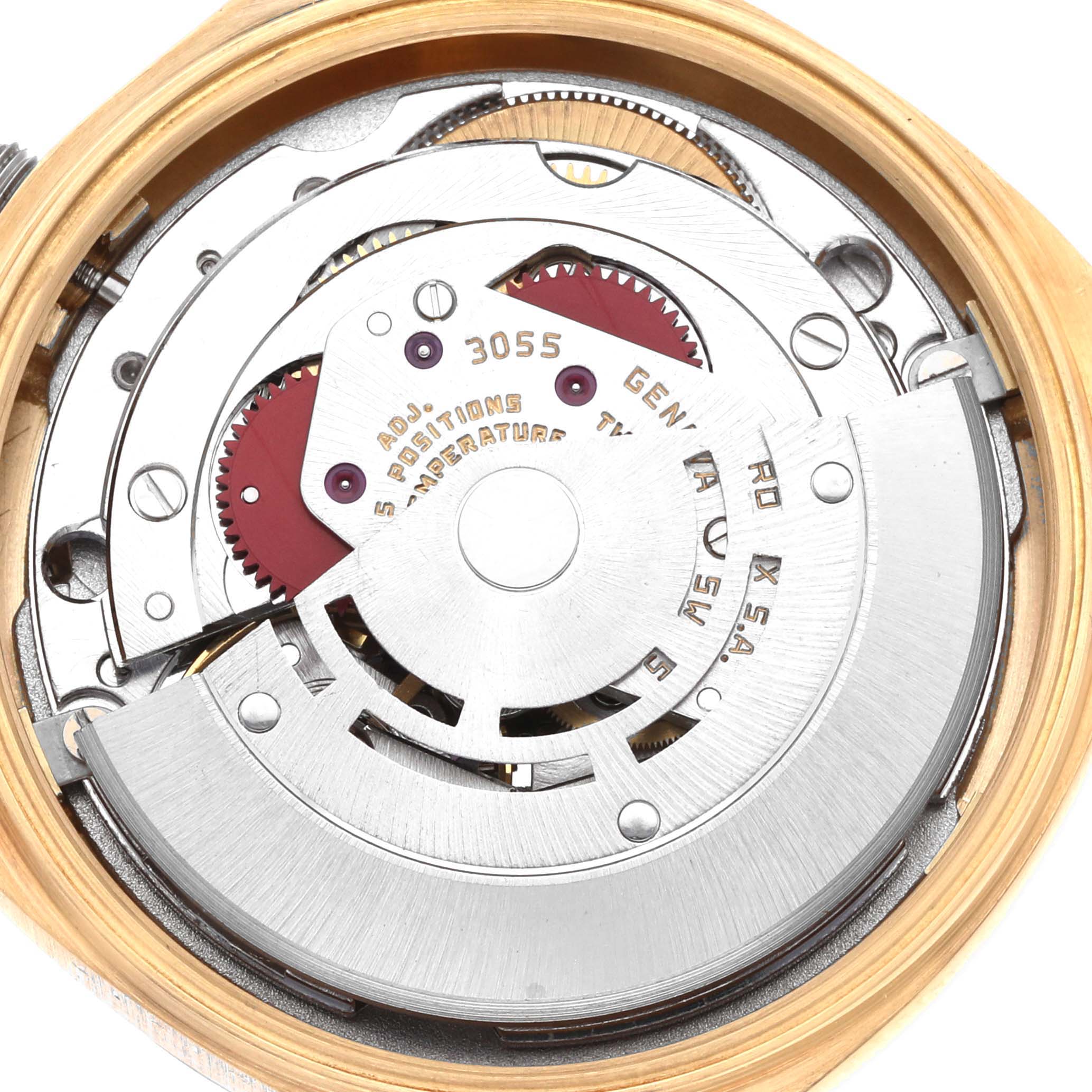 The image shows the internal mechanism of a Rolex President 18038 Men
s Yellow Gold Silver Dial model watch from a top-down angle, highlighting its intricate gears and rotor.