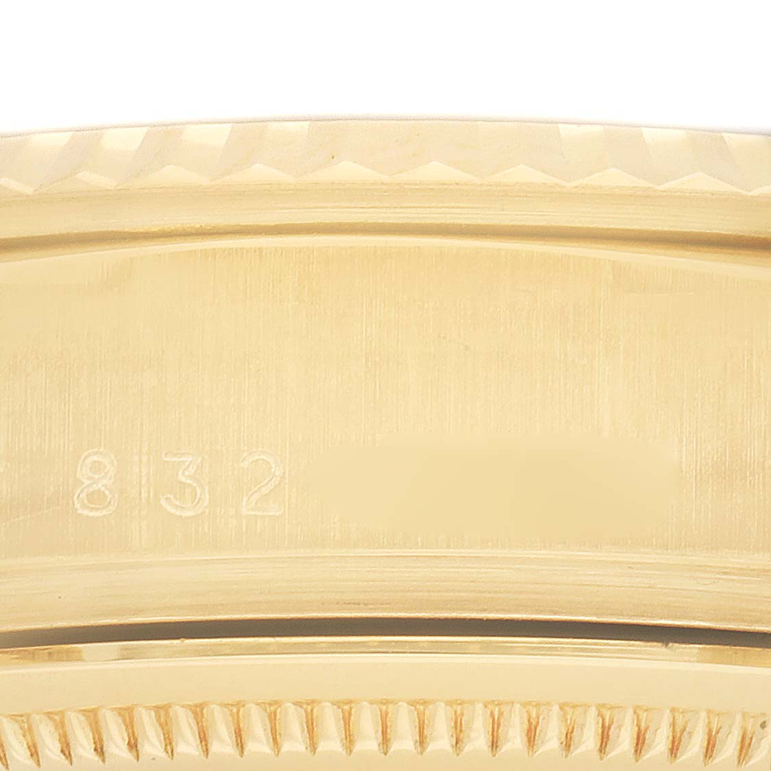 The image shows a close-up of the gold bezel and edge of the Rolex President 18038 Men
s Yellow Gold Silver Dial model watch, highlighting the texture and details.