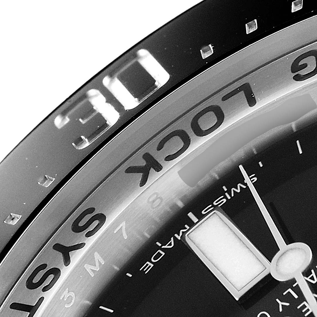 The image shows a close-up of the upper left section of the dial and bezel of a Rolex Sea-Dweller 116660 Men
s Stainless Steel Blue Dial 116660 Men
s Stainless Steel Blue Dial watch.