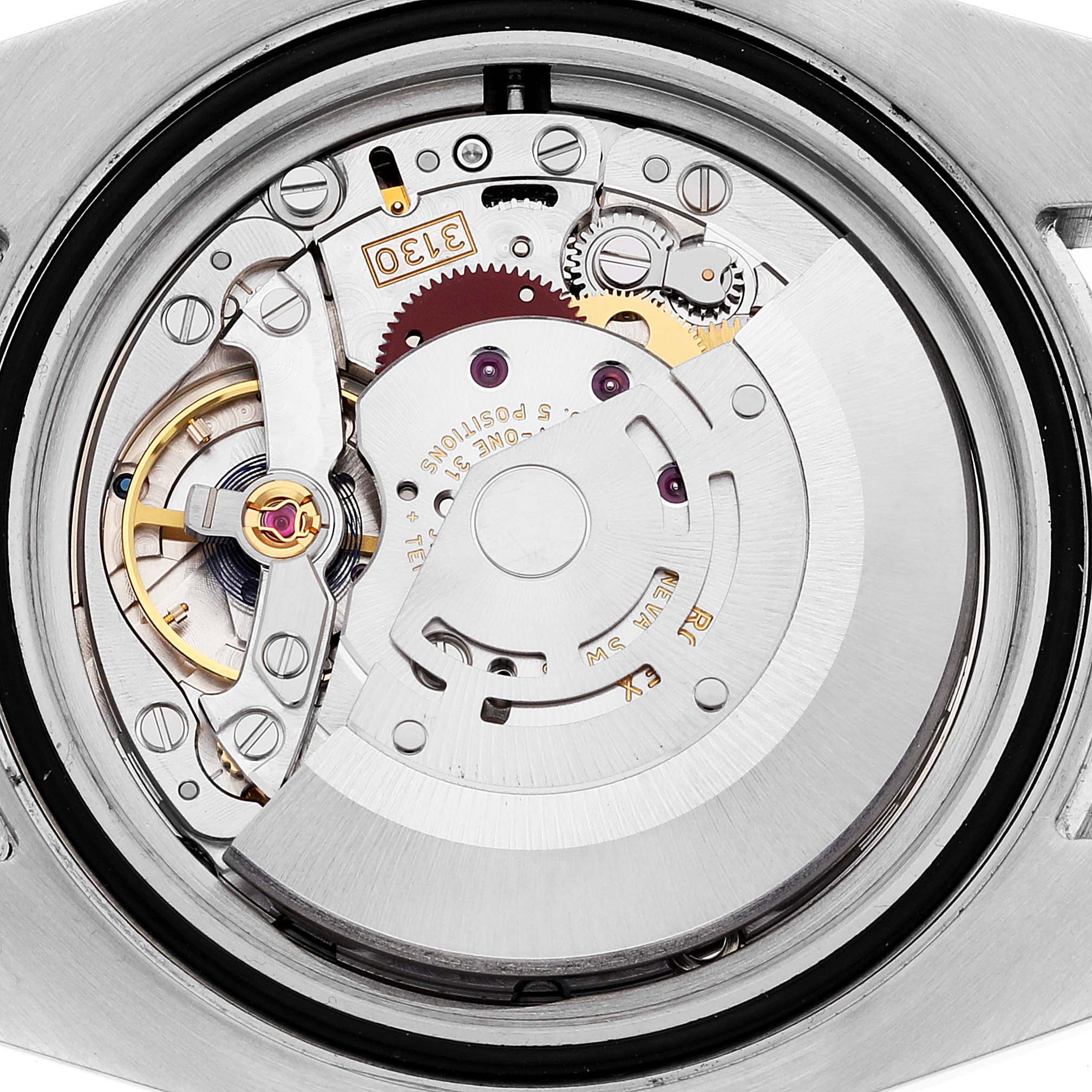 The image displays the inner mechanism of a Rolex Submariner 114060 Men
s Stainless Steel Black Dial 114060 Men
s Stainless Steel Black Dial watch from a rear view, highlighting its intricate movement parts.