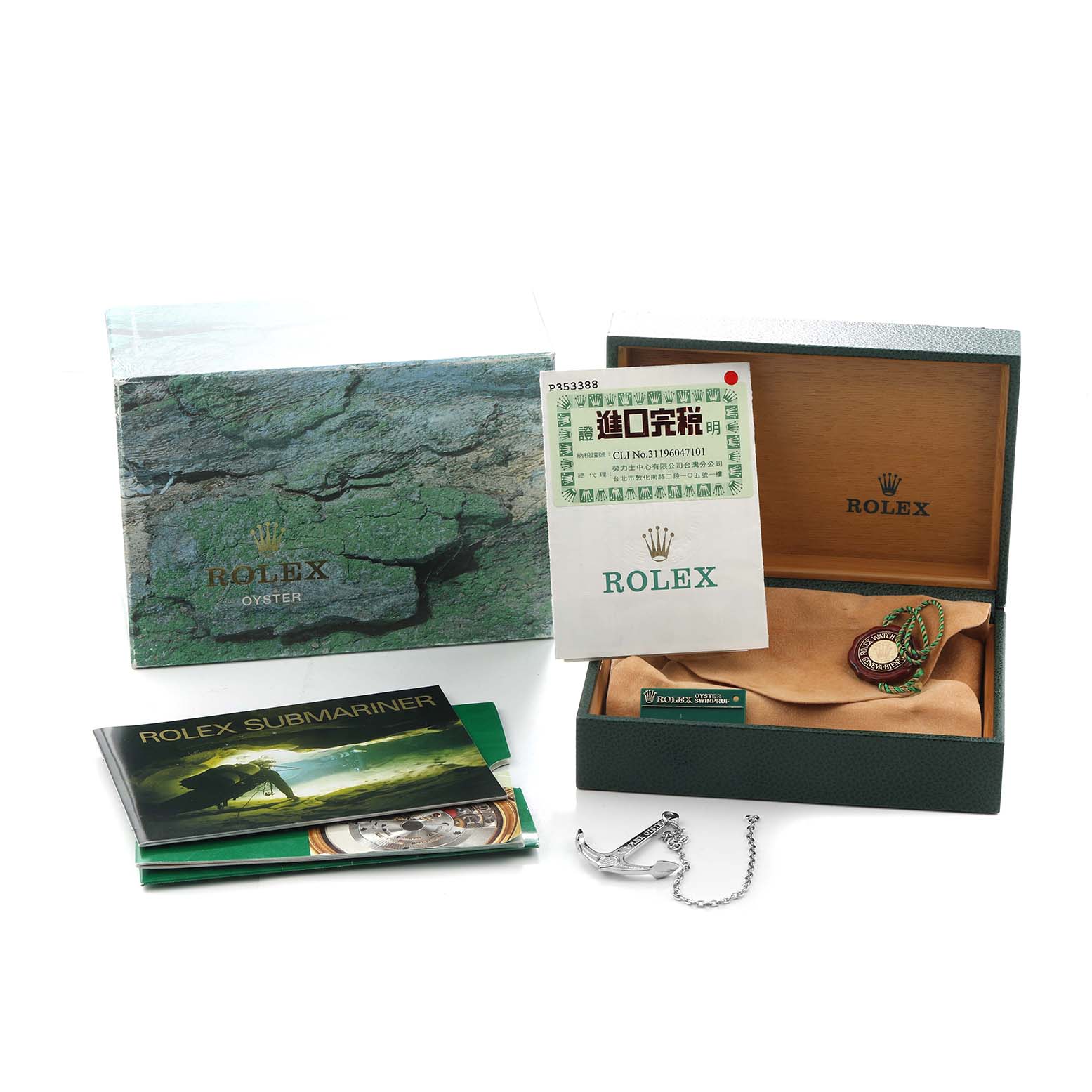 The image shows a Rolex Submariner 16610 Men
s Stainless Steel Black Dial
s box, papers, tags, and accessories, viewed from a slightly elevated angle.