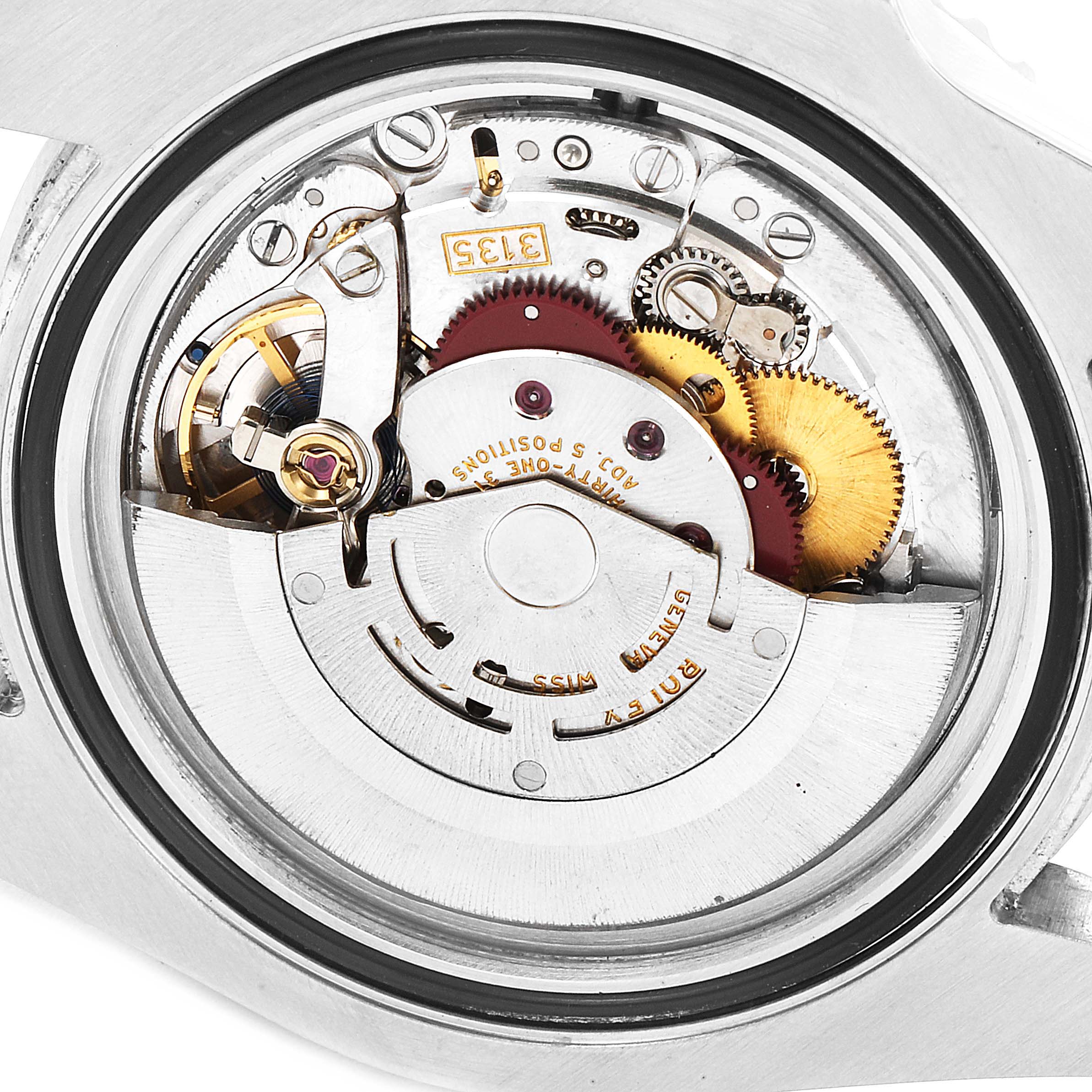 The image shows the inner mechanical movement of a Rolex Submariner 116610LV Men's Stainless Steel Green Dial 116610LV Men's Stainless Steel Green Dial watch with its gears and springs.