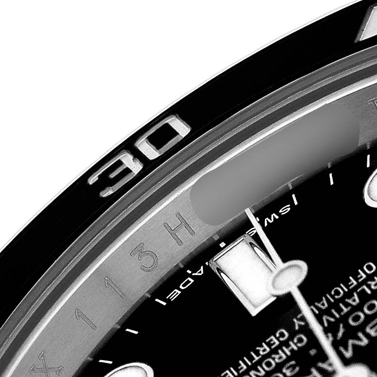 This image shows a close-up of the bezel and part of the dial of a Rolex Submariner 114060 Men's Stainless Steel Black Dial watch.