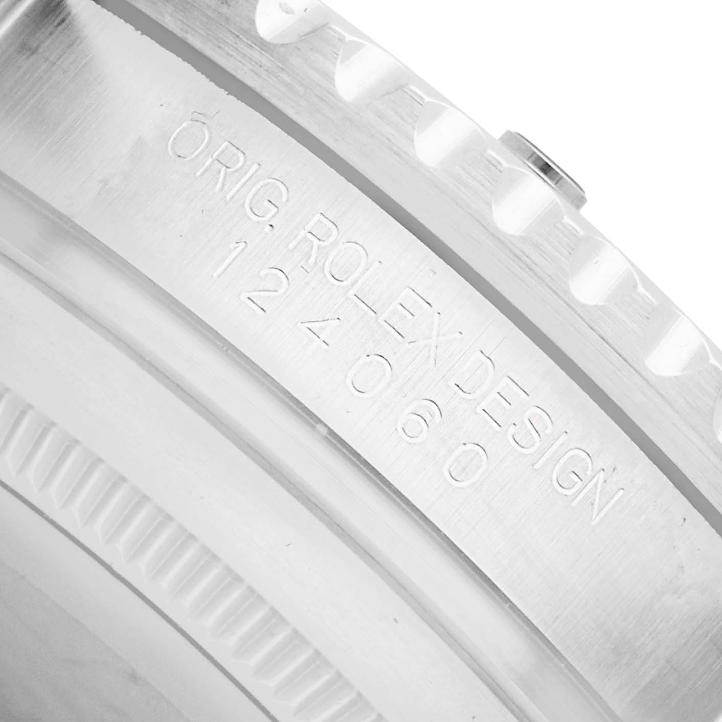 The image shows a close-up of the case back and edge engraving on a Rolex Submariner 124060 Men
s Stainless Steel Black Dial.