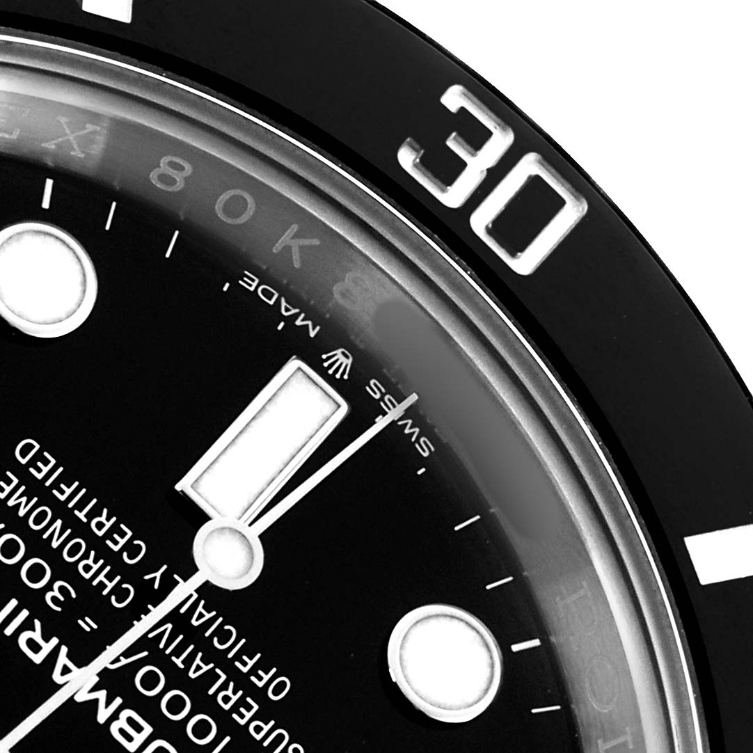 The image shows a close-up of the Rolex Submariner 124060 Men
s Stainless Steel Black Dial watch face and bezel, highlighting the "30" mark.