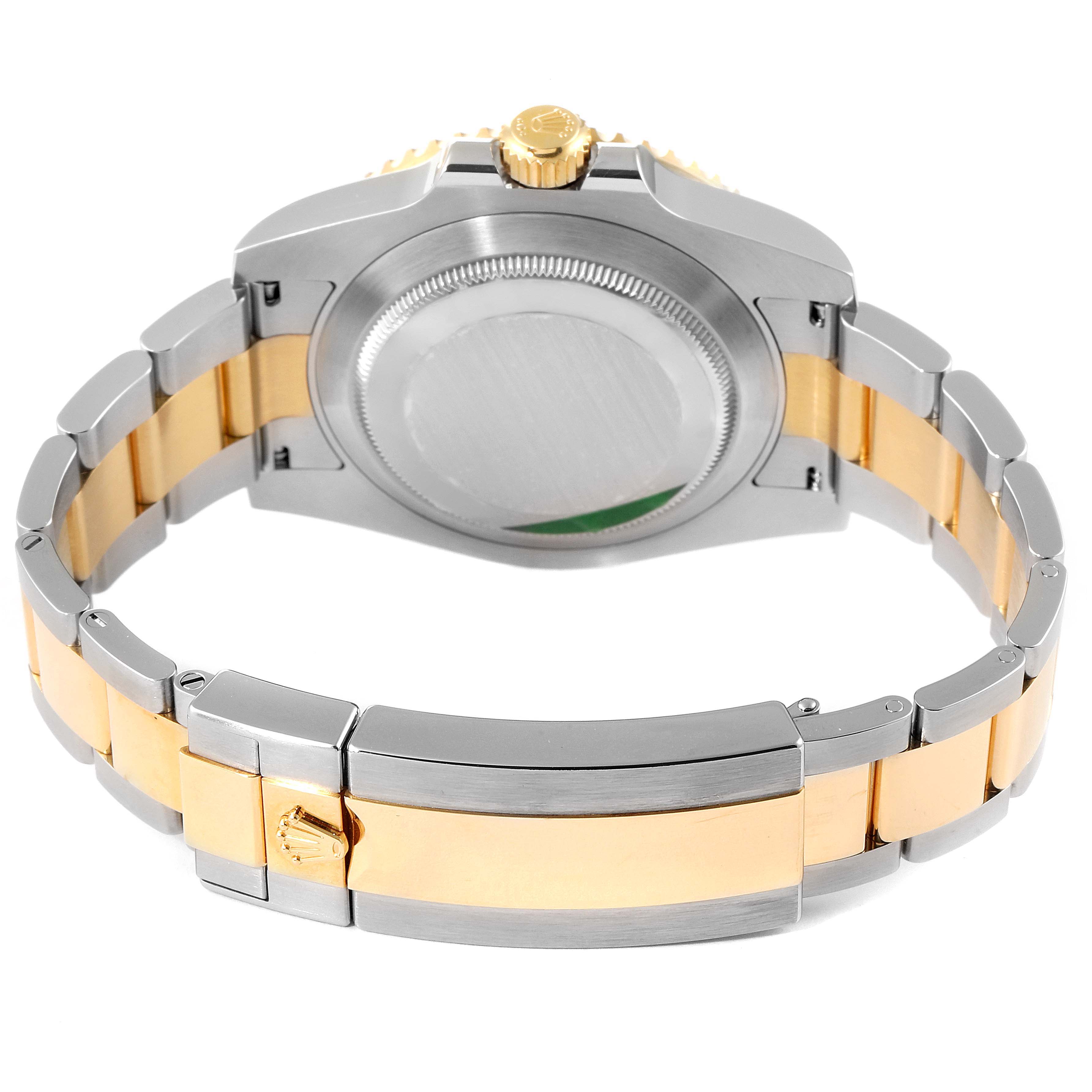 The image shows the back view of a Rolex Submariner 116613 Men's Steel and Gold (two tone) Blue Dial 116613 Men's Steel and Gold (two tone) Blue Dial watch, highlighting the clasp, case back, and bracelet.