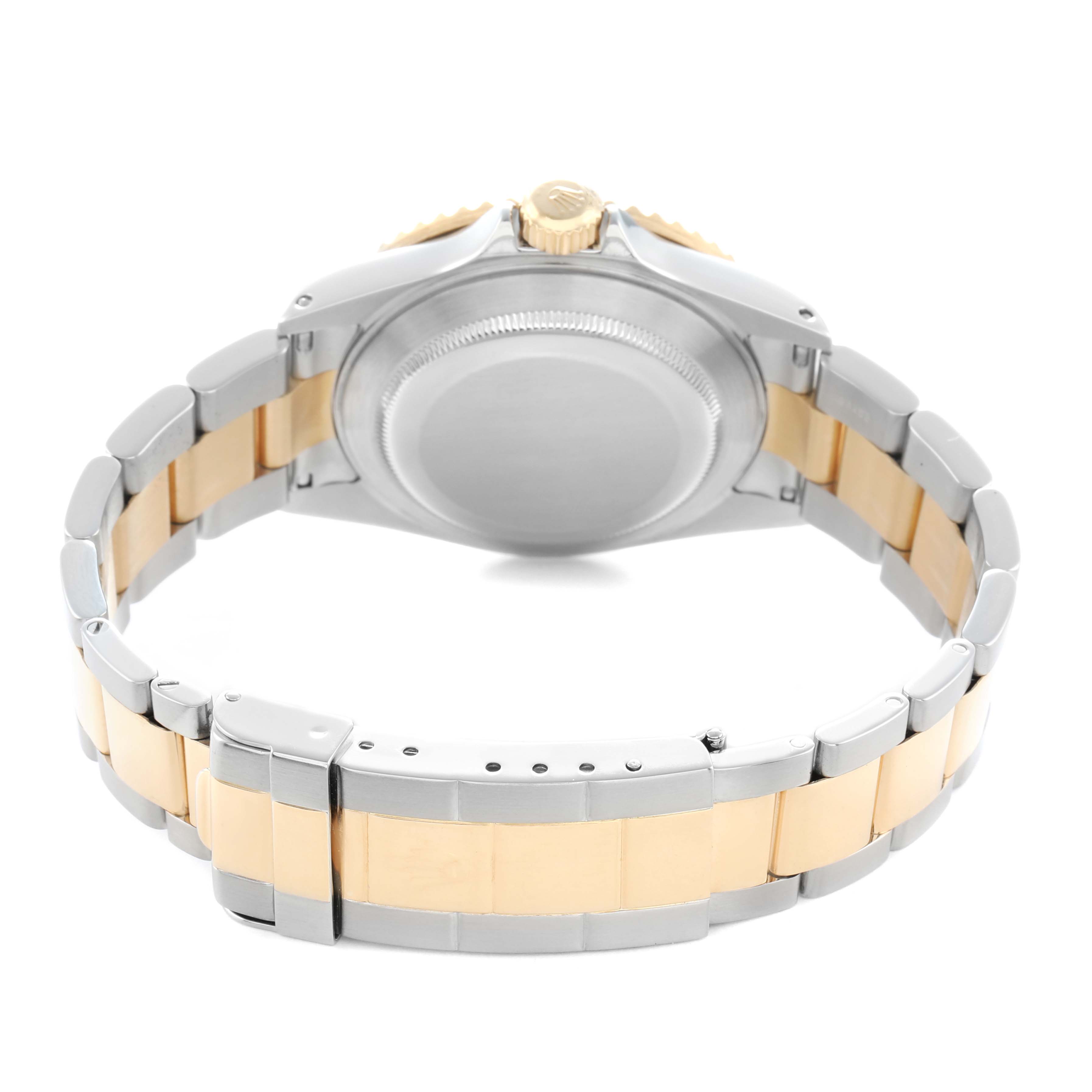 The image shows the back and side of a Rolex Submariner 16613 Men
s Steel and Gold (two tone) Black Dial, highlighting the case back and two-tone bracelet.