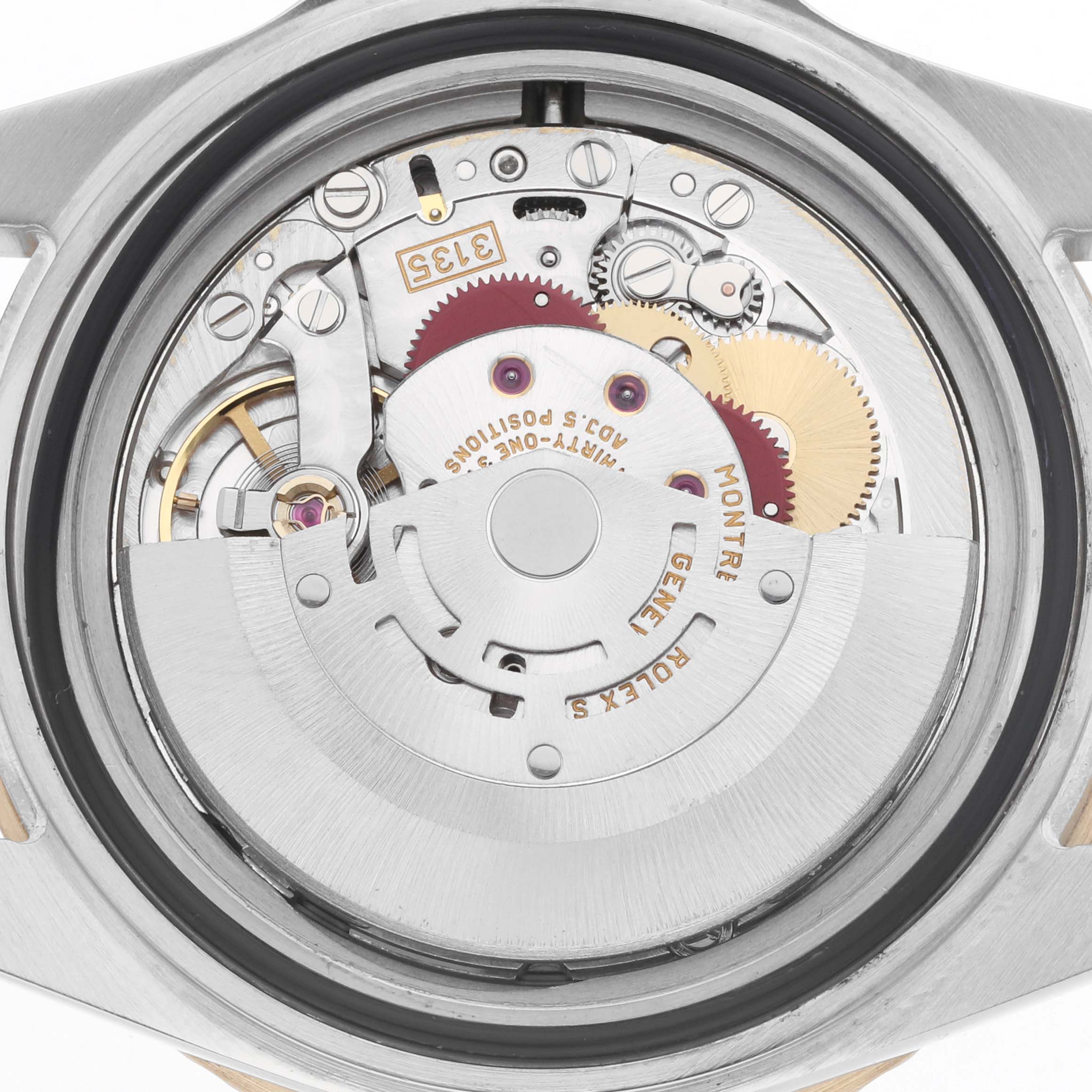 The image shows a close-up of the Rolex Submariner 16613 Men
s Steel and Gold (two tone) Black Dial
s movement, focusing on its mechanical components from the back.