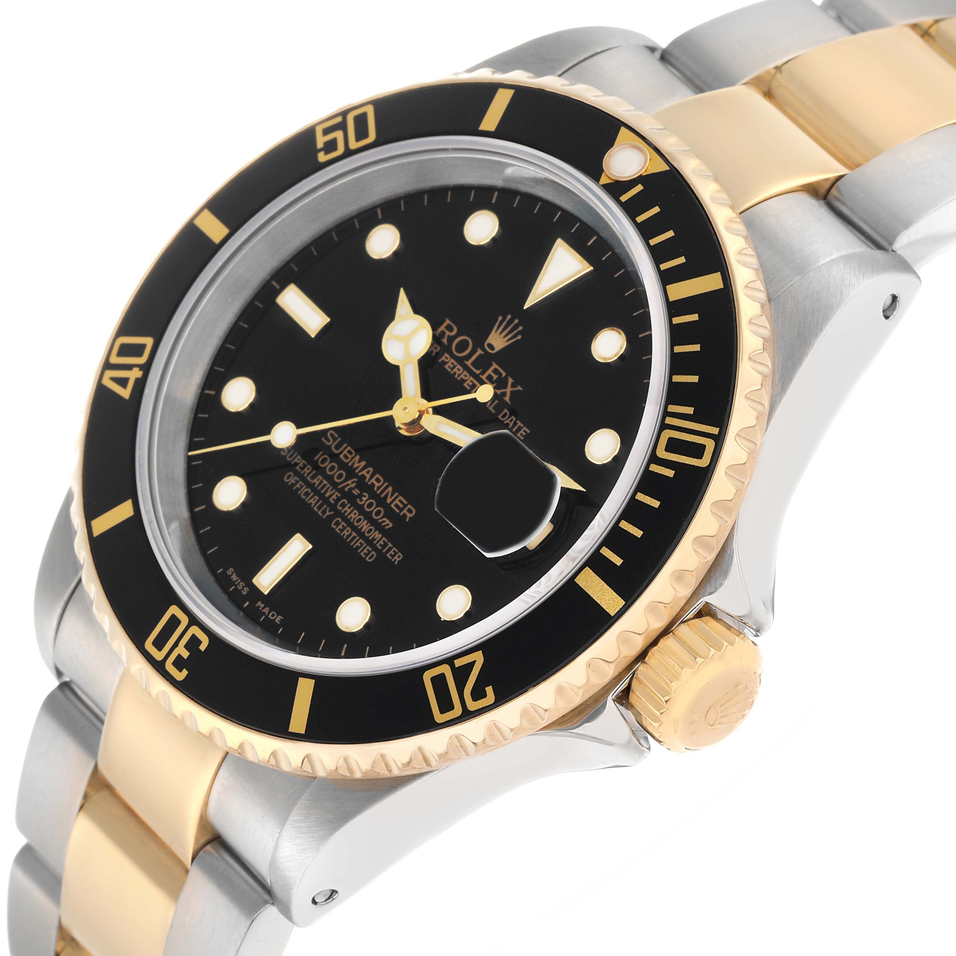 The Rolex Submariner 16613 Men
s Steel and Gold (two tone) Black Dial watch is shown from a high-angle view, highlighting the bezel, crown, two-tone bracelet, and dial details.