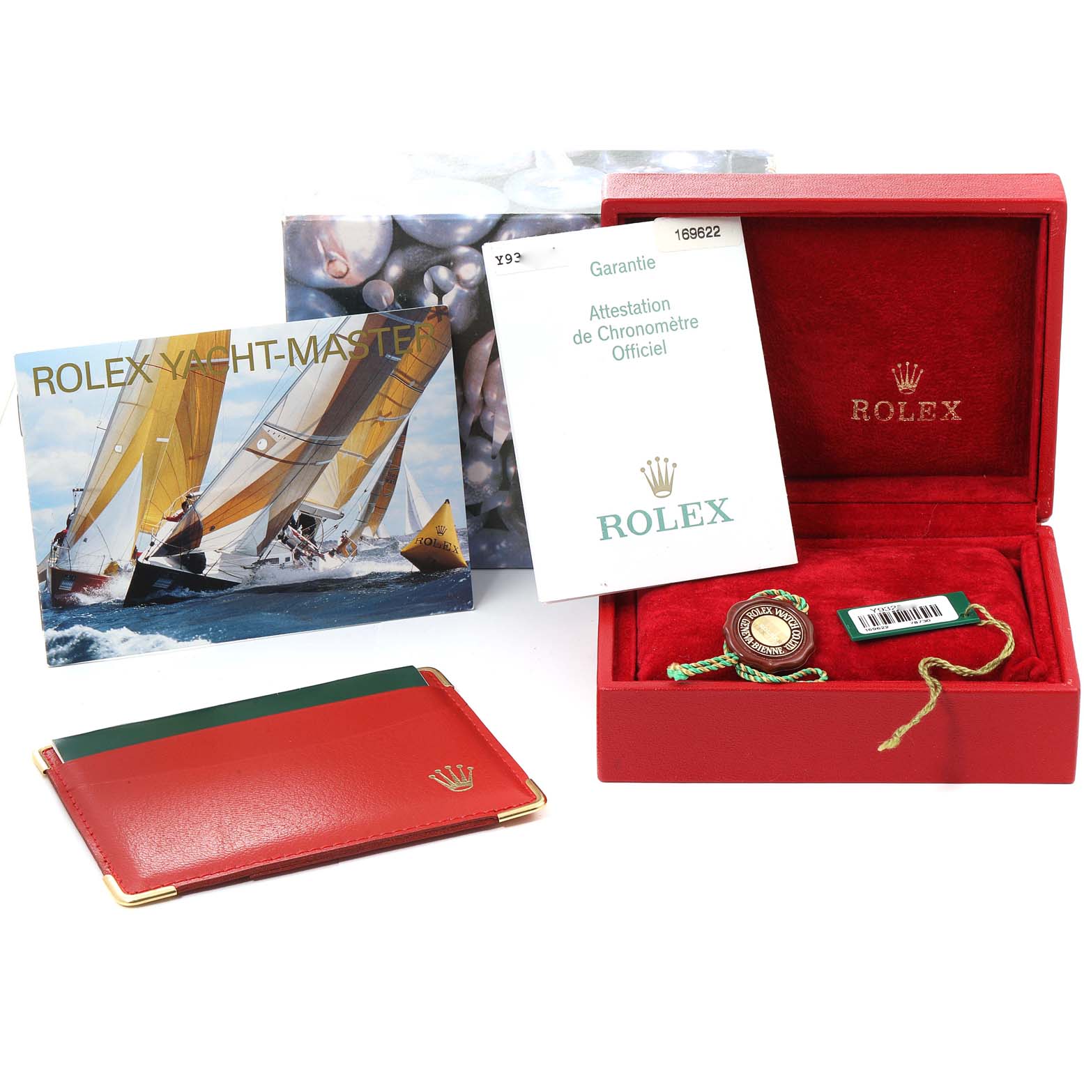 This image shows the packaging accessories for a Rolex Yacht-Master 169622 Women's Stainless Steel Silver Dial 169622 Women's Stainless Steel Silver Dial watch, including the box, booklets, and tags.