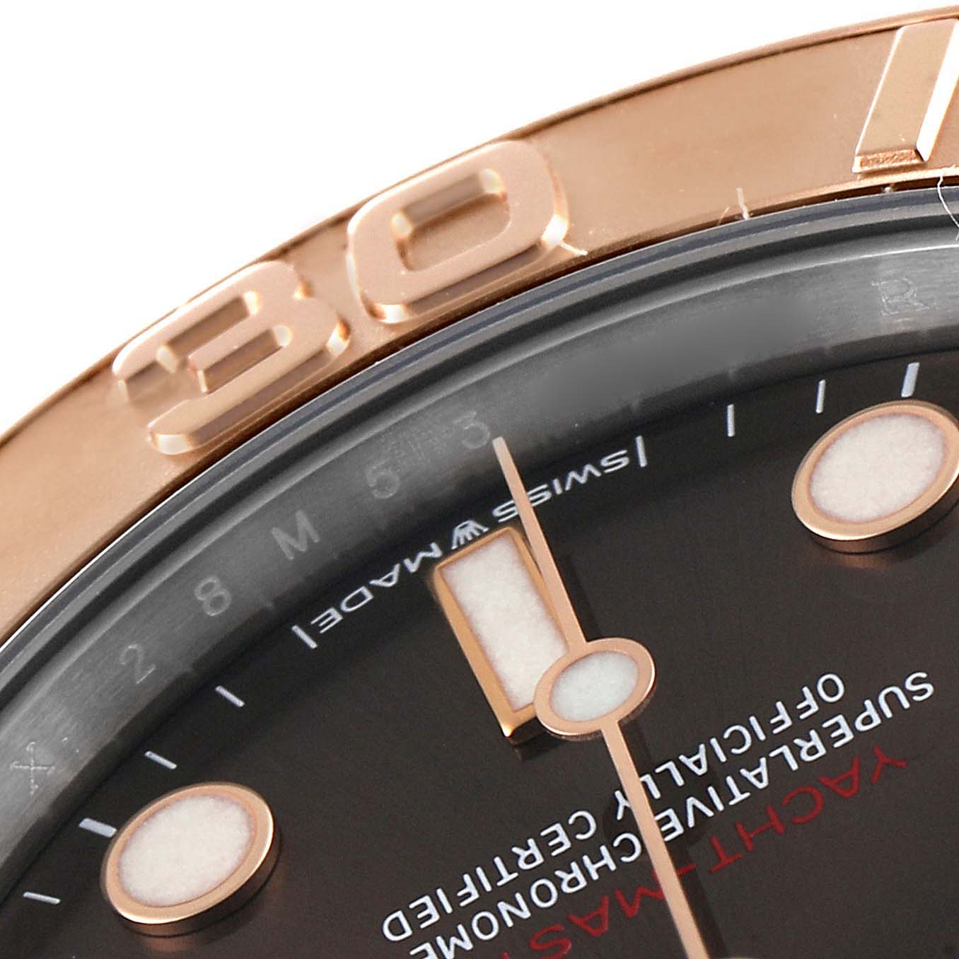 This close-up image shows the bezel, part of the face, and the hour markers of a Rolex Yacht-Master 268621 Men's Steel and Gold (two tone) Brown Dial 268621 Men's Steel and Gold (two tone) Brown Dial watch.