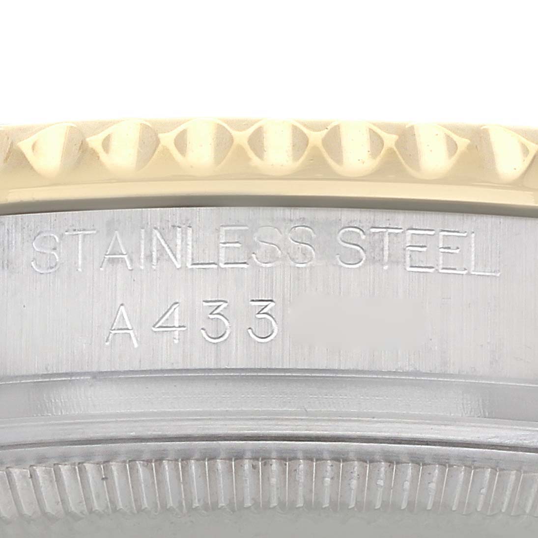 The image shows a close-up of the edge and side of a Rolex Yacht-Master 168623 Men
s Steel and Gold (two tone) White Dial
s stainless steel bezel.