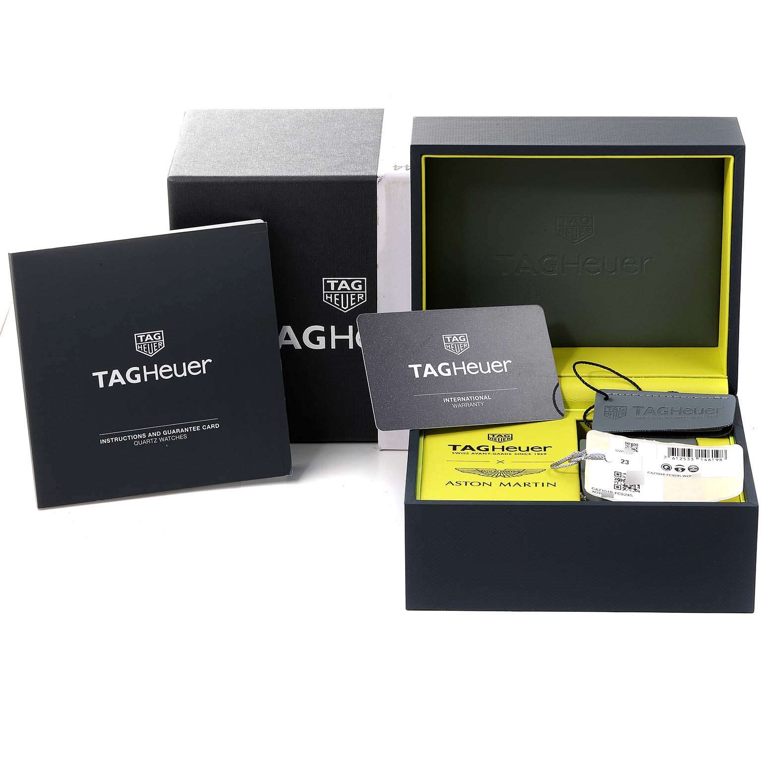 The image shows the packaging, warranty cards, and tags for a Tag Heuer Formula 1 CAZ101P.FC8245 Men's Stainless Steel Black Dial CAZ101P.FC8245 Men's Stainless Steel Black Dial watch.