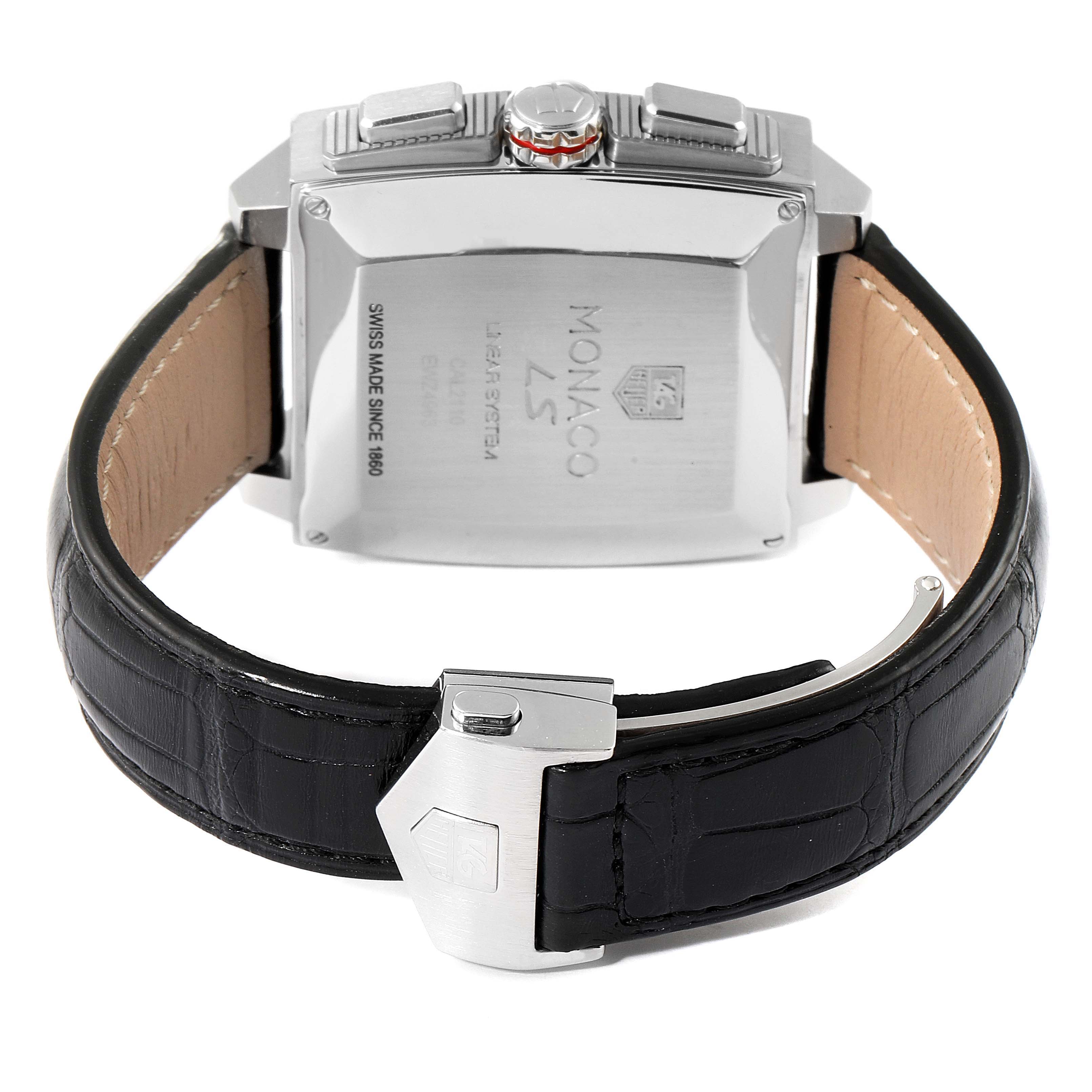 The image shows the back of the Tag Heuer Monaco CAL2110.FC6257 Men's Stainless Steel Black Dial CAL2110.FC6257 Men's Stainless Steel Black Dial watch, focusing on its case back, crown, buttons, and leather strap.