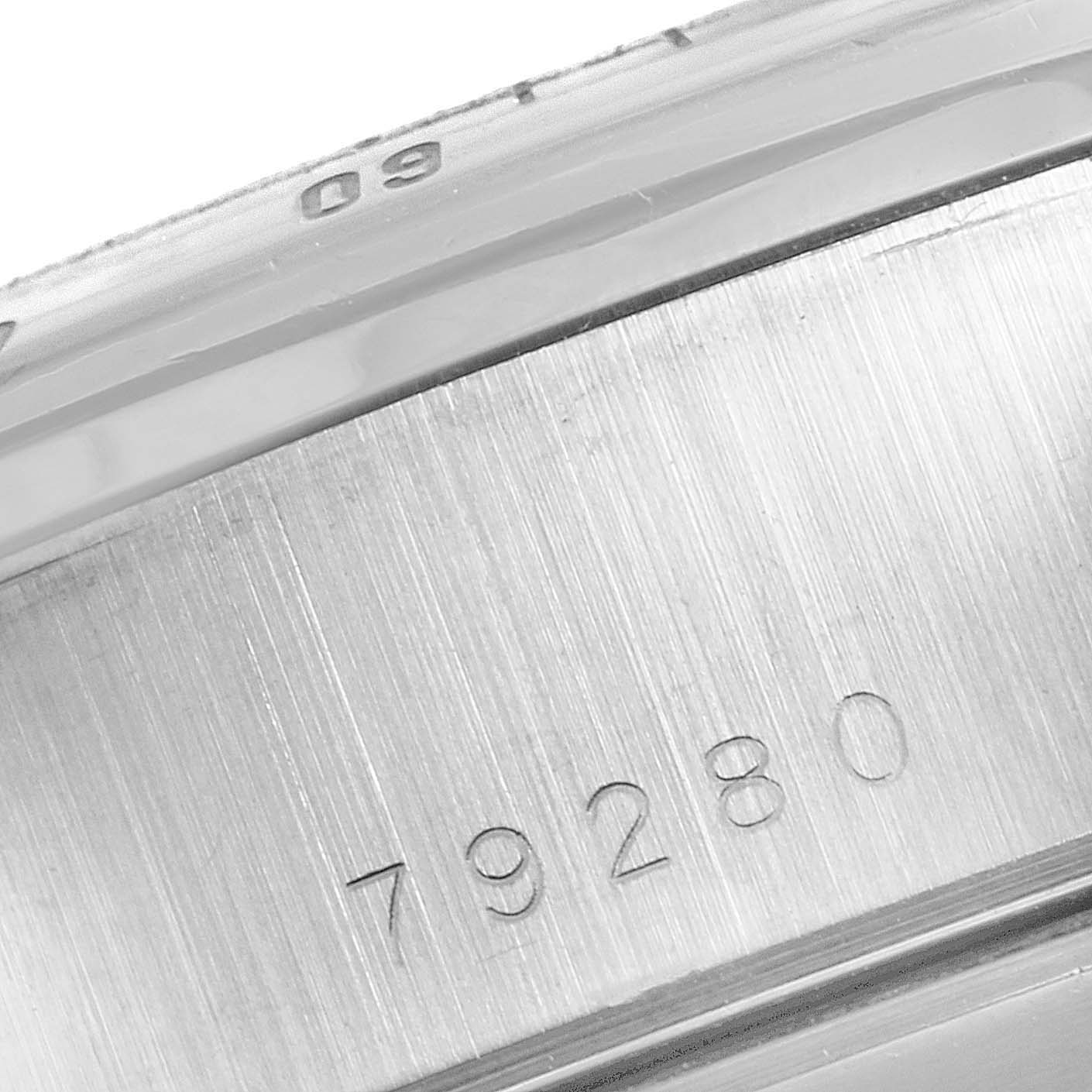 This close-up image of the Tudor Prince 79280 Men
s Stainless Steel Black Dial 79280 Men
s Stainless Steel Black Dial model watch shows the engraved model number "79280" on its brushed metal case.