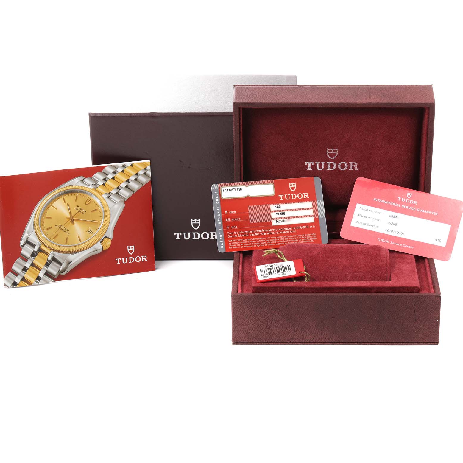 The image shows a Tudor Prince 79280 Men
s Stainless Steel Black Dial 79280 Men
s Stainless Steel Black Dial watch with its original packaging, warranty cards, and user manual.