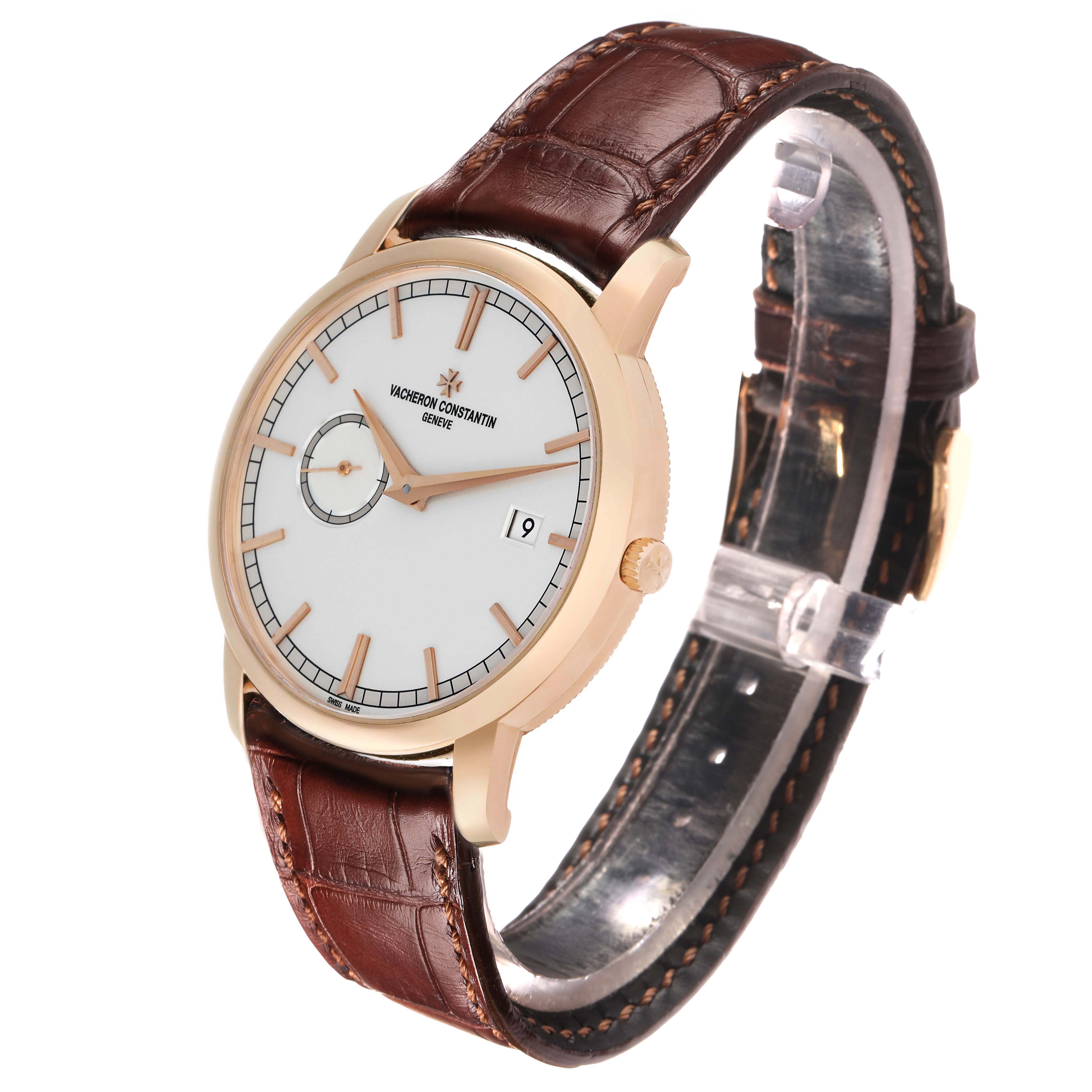 The Vacheron Constantin Traditionnelle 87172 Men
s Rose Gold Silver Dial watch is shown at an angled view, displaying its face and brown leather strap.