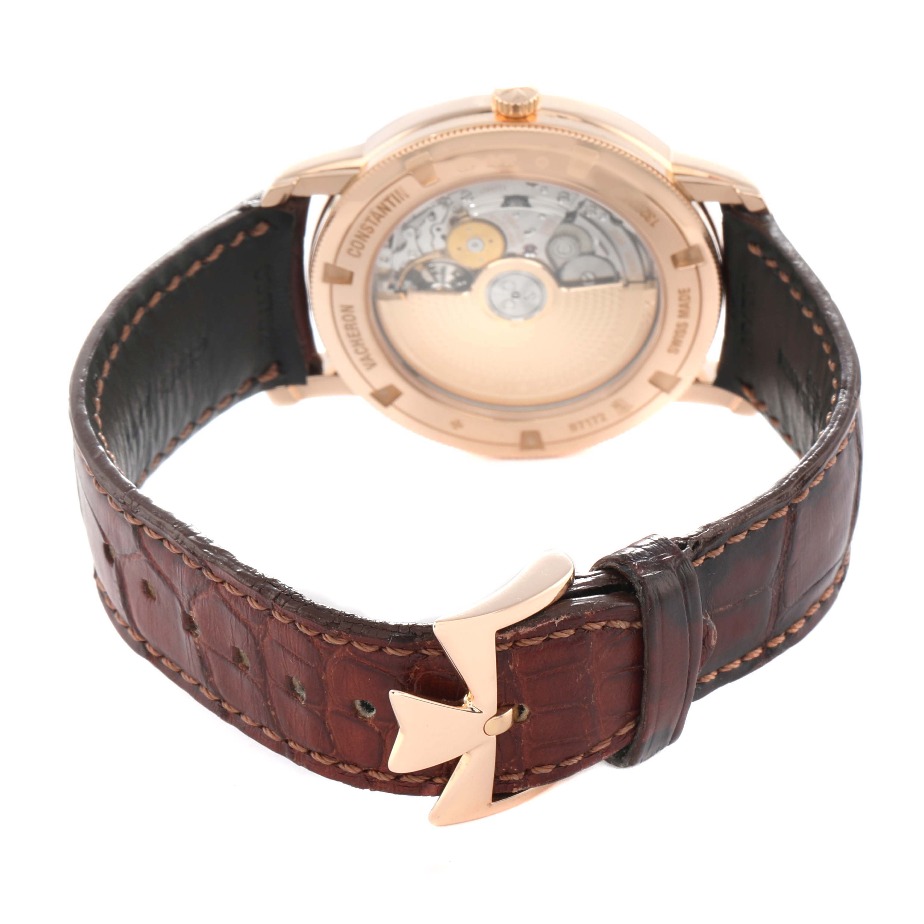 The image shows the back view of a Vacheron Constantin Traditionnelle 87172 Men
s Rose Gold Silver Dial watch, highlighting the movement and leather strap buckle.