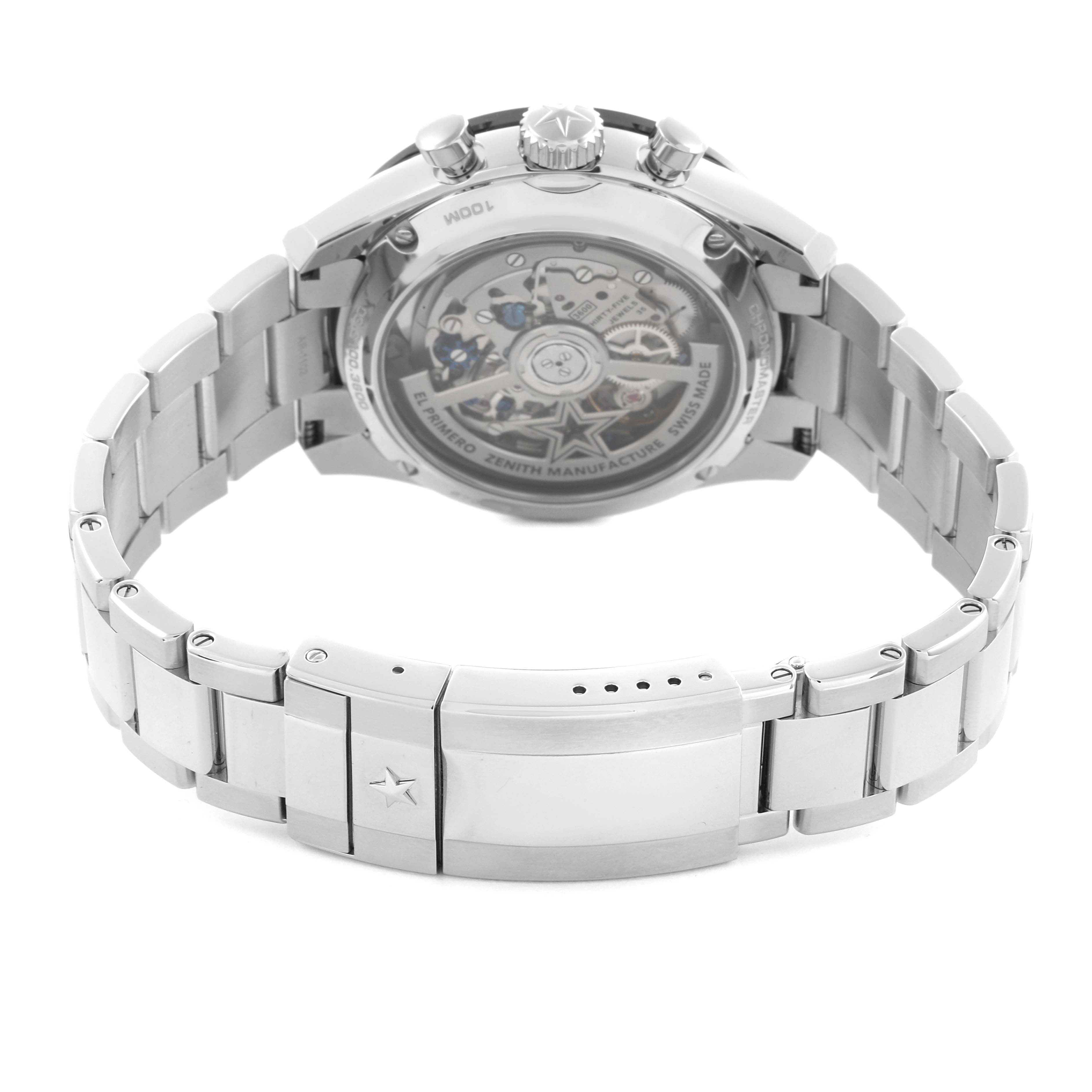 The image shows the back of the Zenith El Primero 03.3100.3600 Men
s Stainless Steel White Dial watch with the metal bracelet and visible movement.