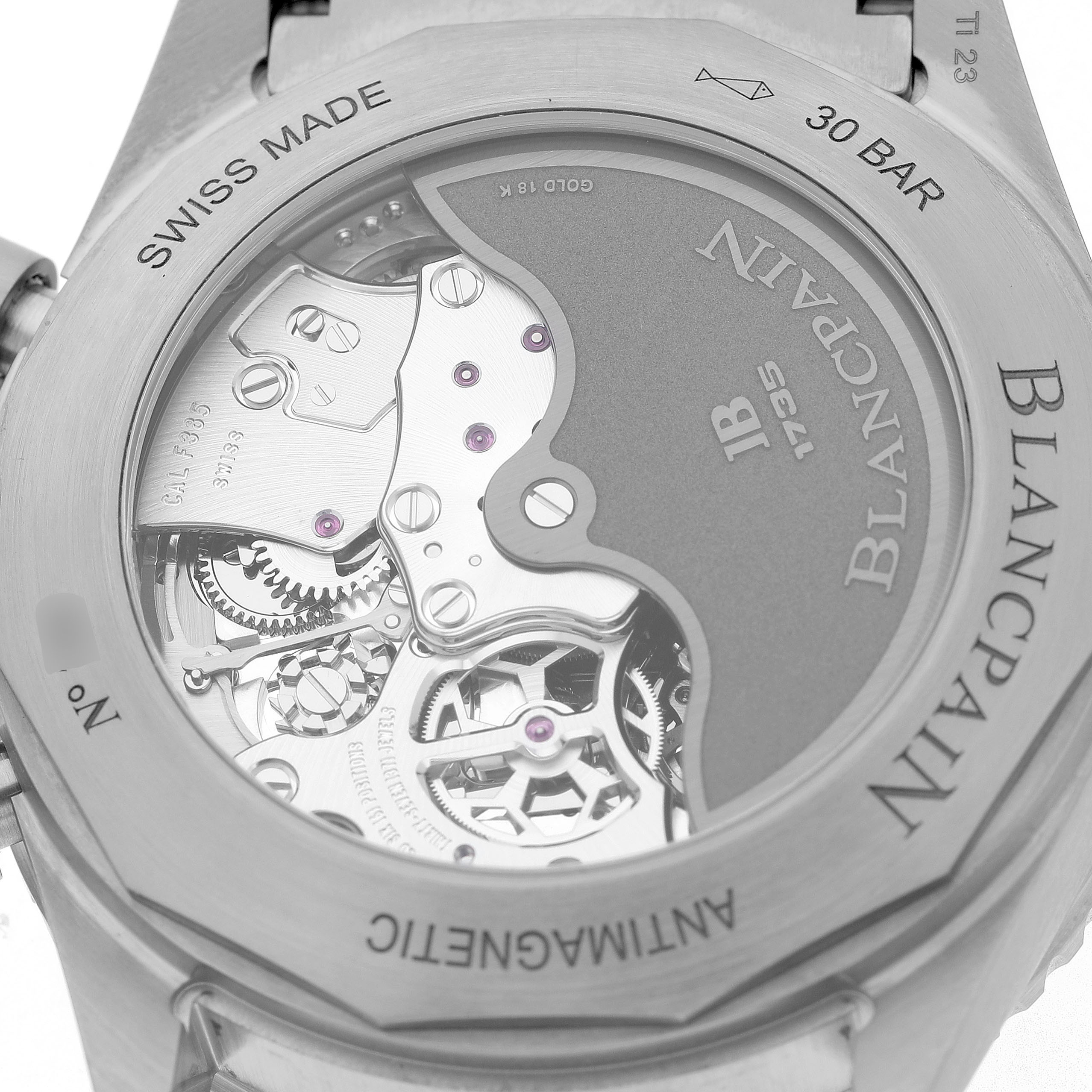 The image shows the back of a Blancpain Fifty Fathoms 5200-1210-98S Men's Titanium Grey Dial watch, highlighting its intricate automatic movement.